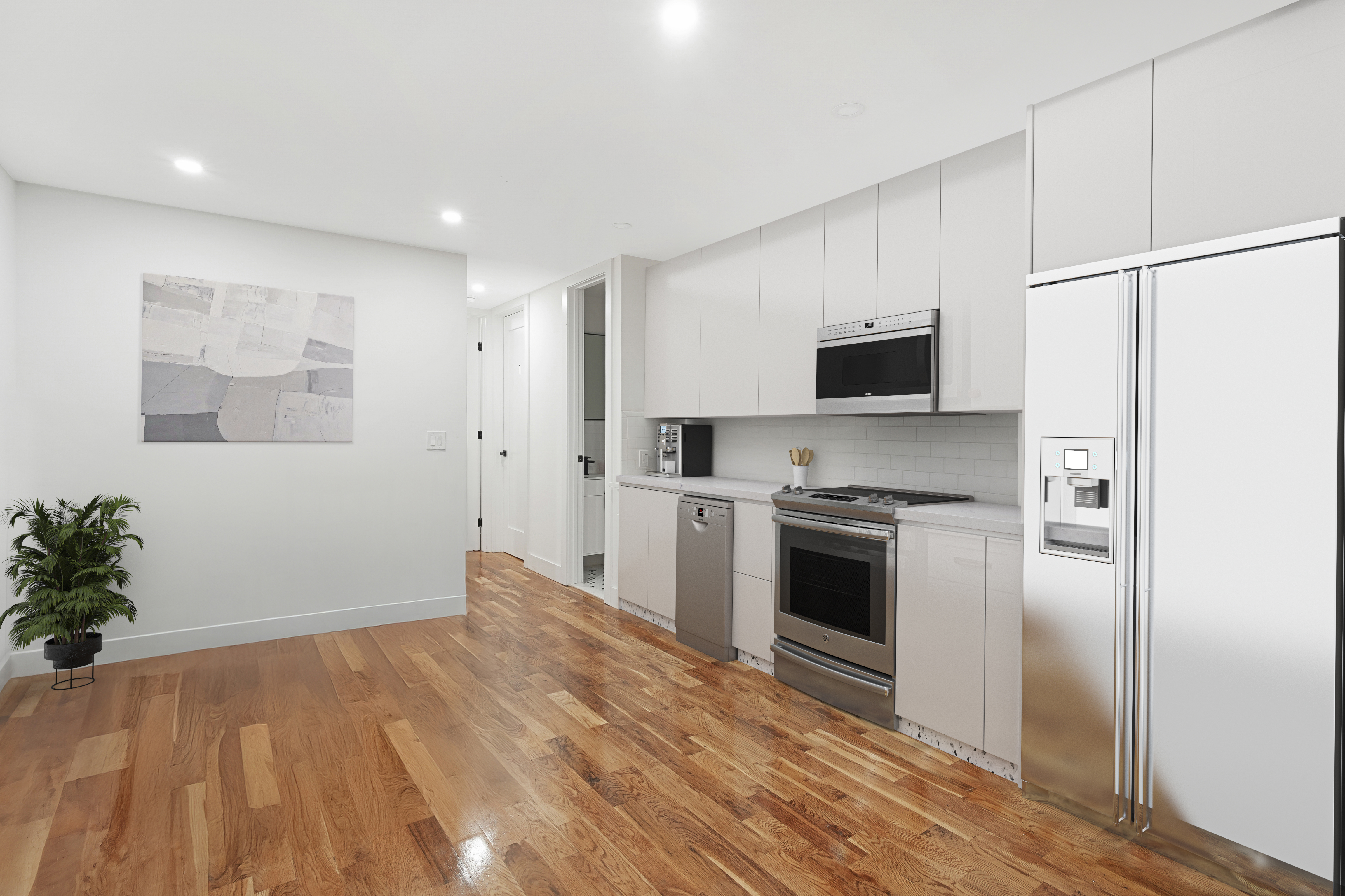 1390 Eastern Parkway Brooklyn, NY 11233 - Photo 14 of 19 a kitchen with stainless steel appliances a refrigerator sink and microwave