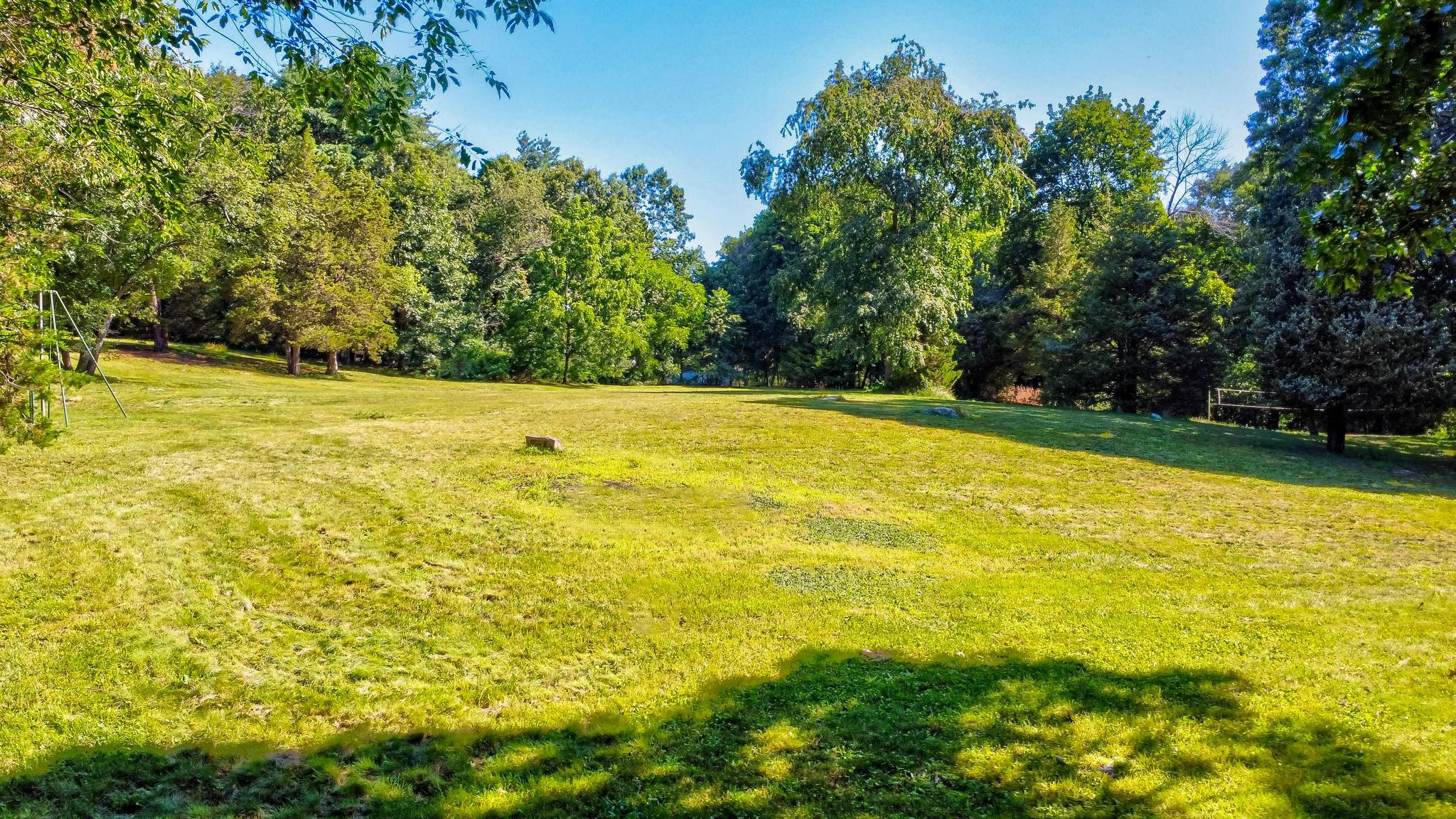 14 Barberry Road Lexington, MA 02421 - Photo 28 of 30 a view of a large yard with an outdoor space