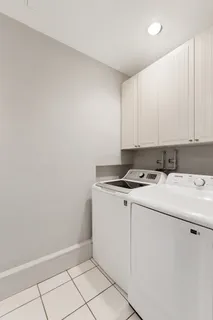 a view of a storage and utility room with washer and dryer