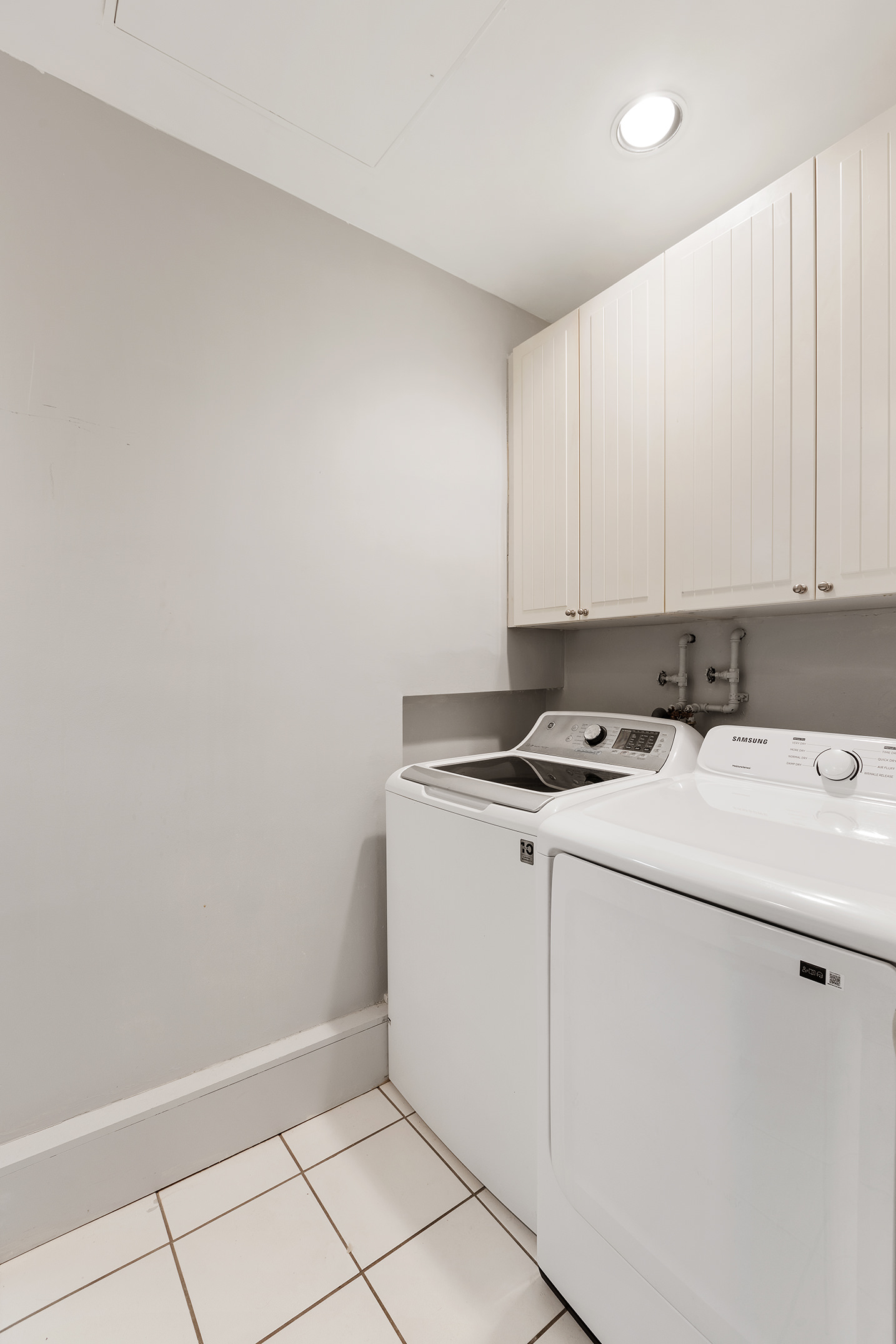138 West 73rd Street Manhattan, NY 10023 - Photo 15 of 35 a view of a storage and utility room with washer and dryer