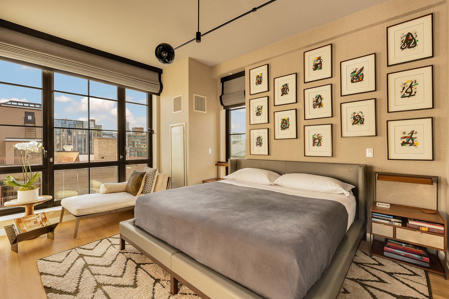 a bed sitting in a bedroom next to a large window