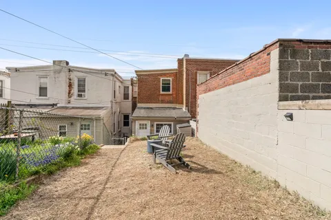 a bench sitting in front of a house
