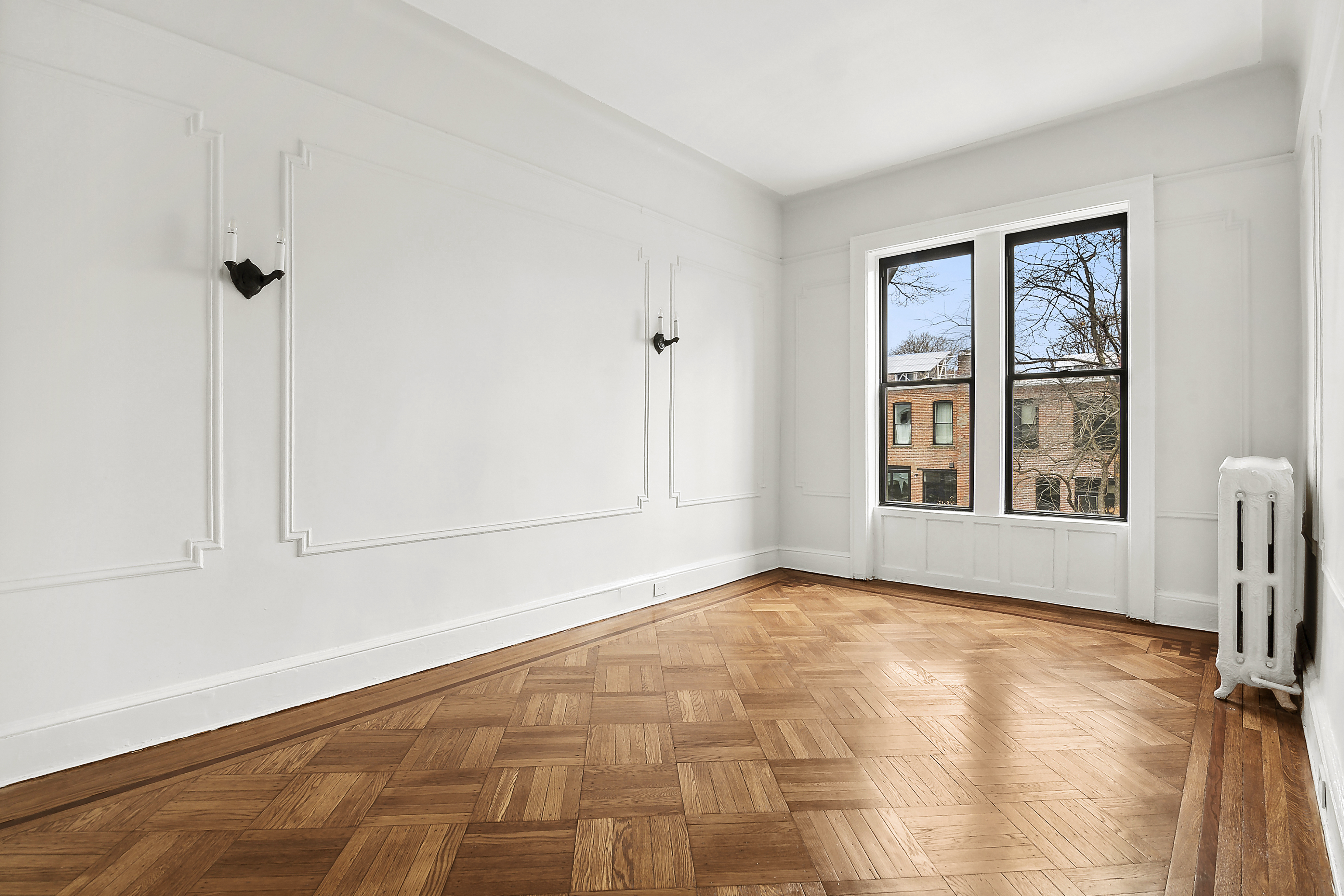 195 Rutland Road Brooklyn, NY 11225 - Photo 12 of 21 a view of an empty room with a window