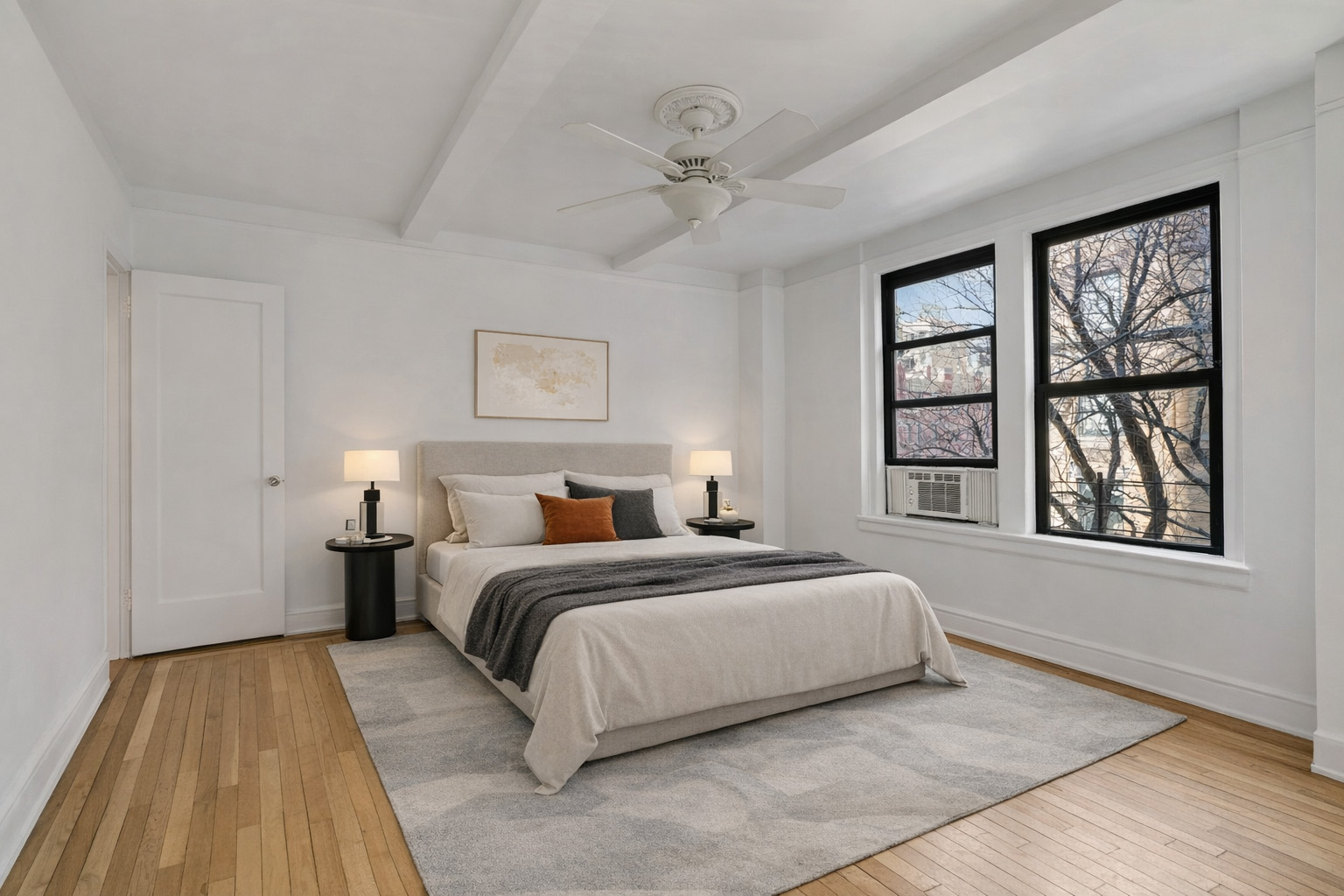 74 West 68th Street, Unit 5A Manhattan, NY 10023 - Photo 9 of 25 a bedroom with a large bed and a window