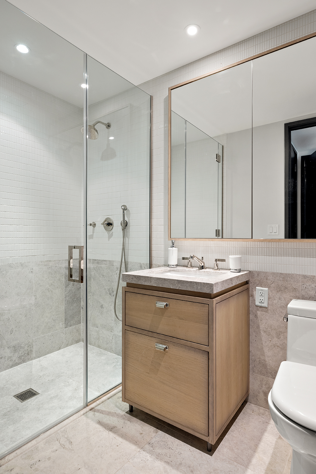 51 Jay Street, Unit 3C Brooklyn, NY 11201 - Photo 8 of 10 a bathroom with a sink a toilet and shower