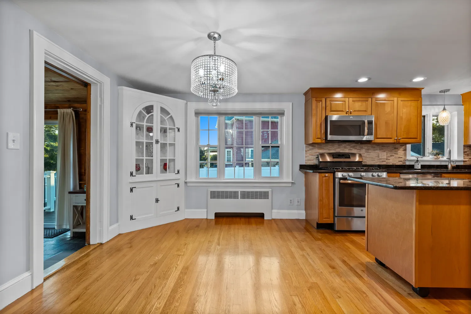 a view of kitchen and sink with wooden floor