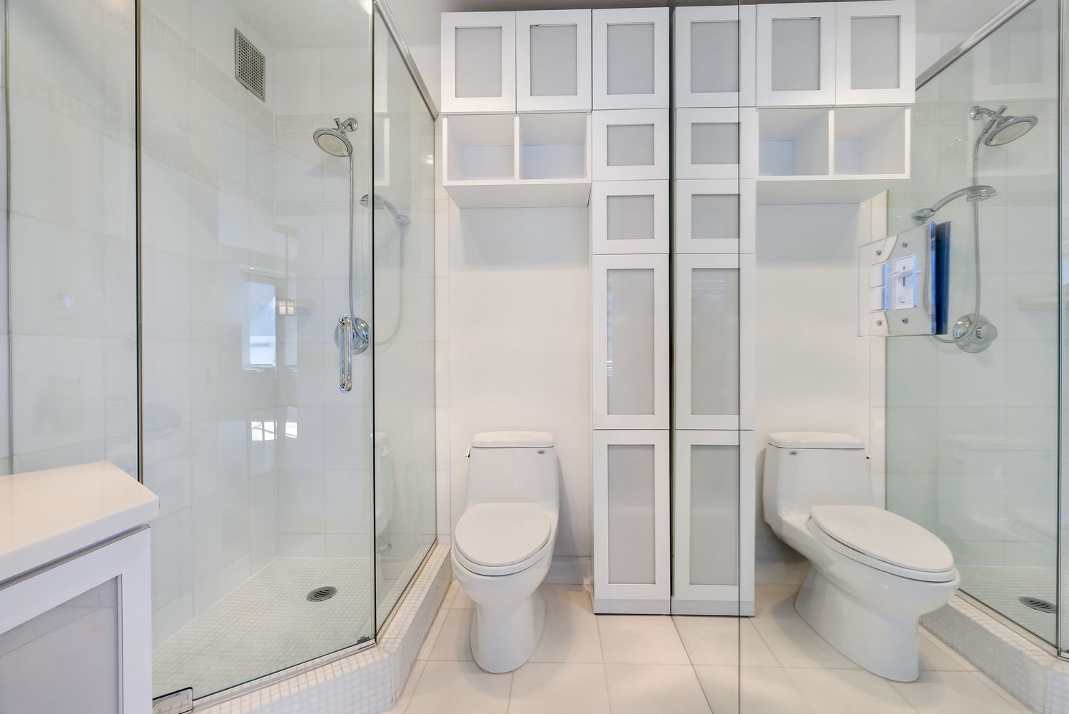 a bathroom with a toilet and shower