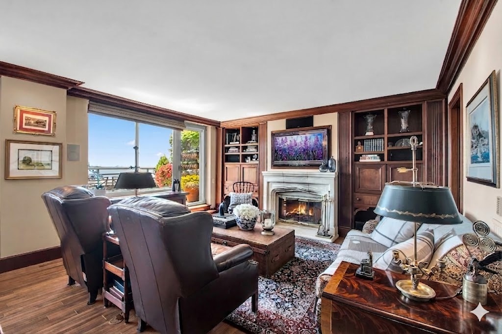 21 South End Avenue, Unit PH1A Manhattan, NY 10280 - Photo 2 of 32 a living room with furniture fireplace and flat screen tv