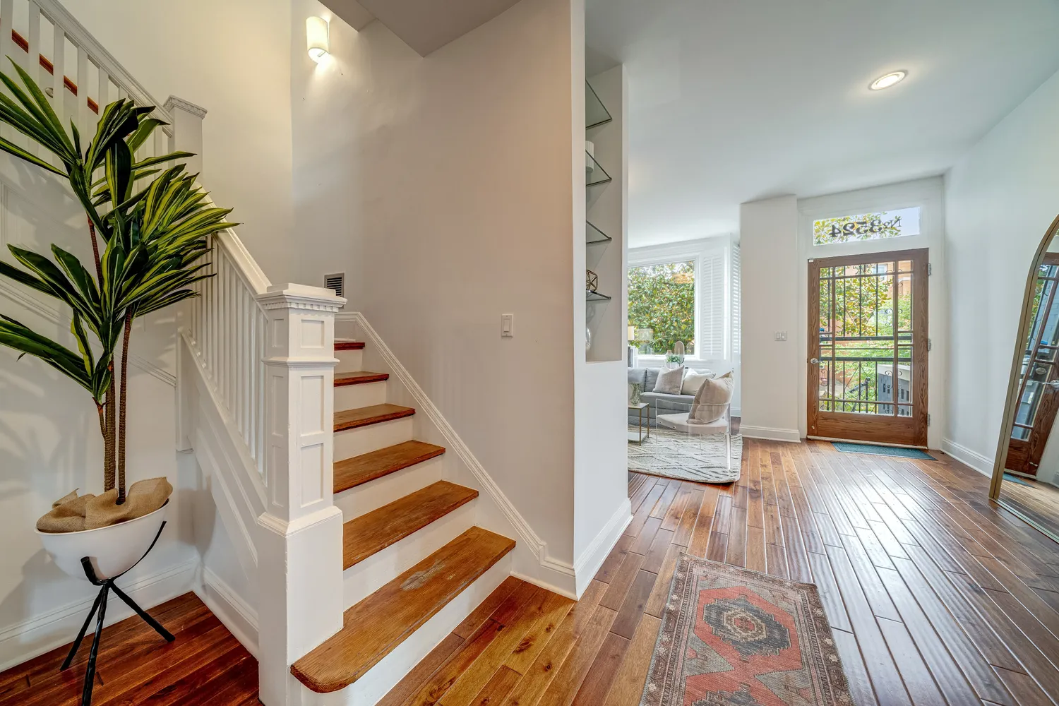 a kitchen with granite countertop a sink stainless steel appliances and cabinets