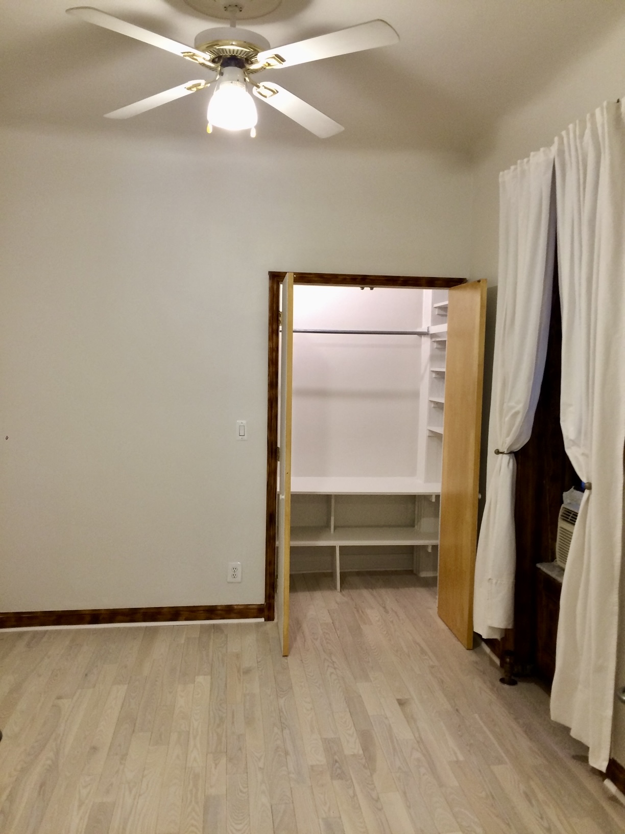 323 West 83rd Street, Unit 1C Manhattan, NY 10024 - Photo 8 of 8 a view of walk in closet with clothes and shoes