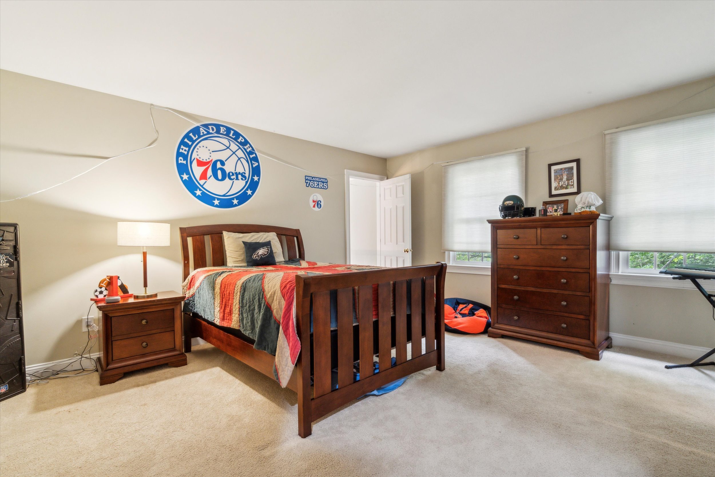 145 Biddulph Road Wayne, PA 19087 - Photo 25 of 39 a bedroom with a bed and a chandelier