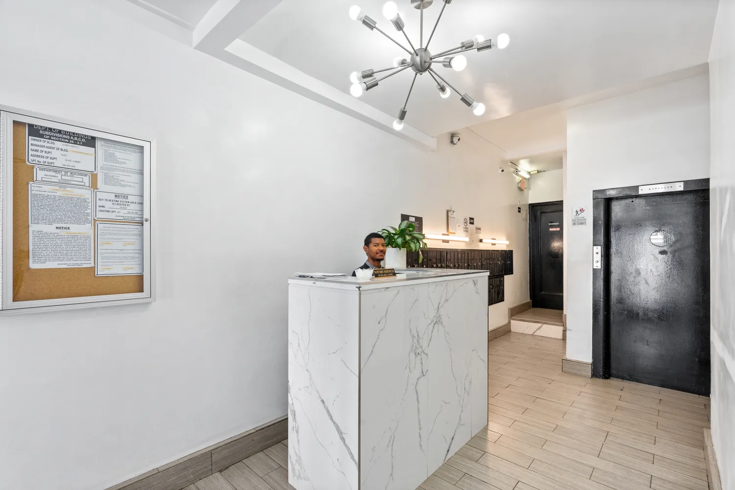 a kitchen with kitchen island a counter top space cabinets and stainless steel appliances