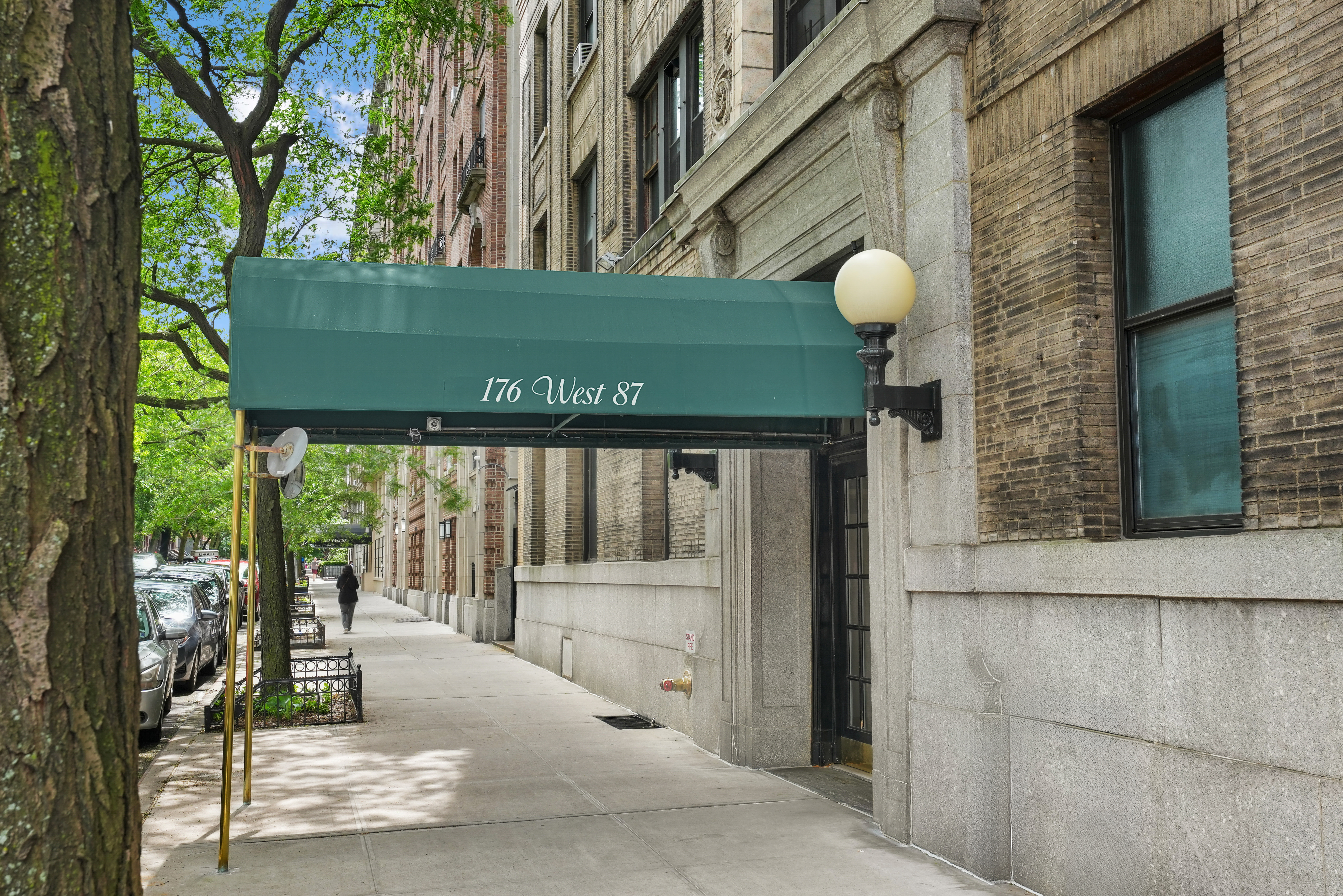 176 West 87th Street, Unit 1H Manhattan, NY 10024 - Photo 18 of 19 a view of a entrance gate of the house and tree