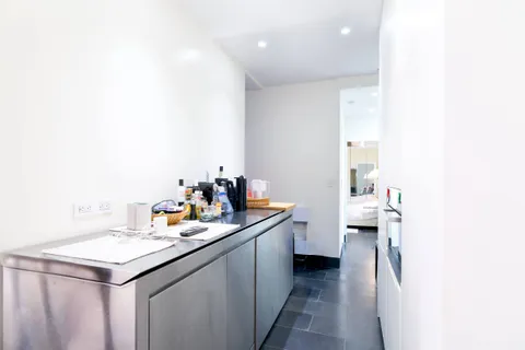 a kitchen with a sink and cabinets