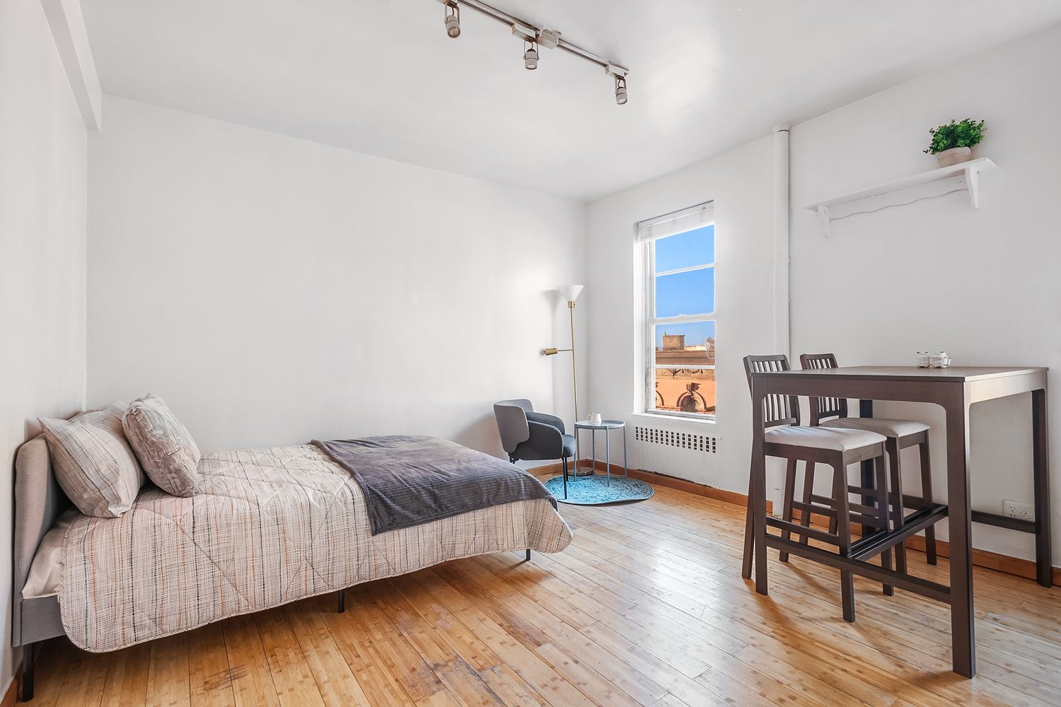 304 West 10th Street, Unit 4B Manhattan, NY 10014 - Photo 2 of 10 a living room with furniture and wooden floor