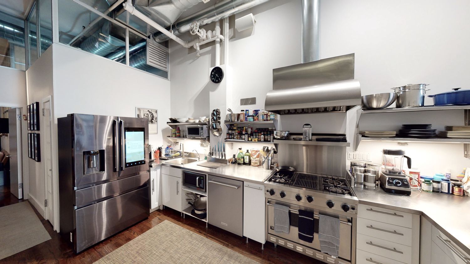 382 Lafayette Street, Unit 2 Manhattan, NY 10003 - Photo 7 of 19 a kitchen with stainless steel appliances granite countertop a refrigerator and a stove