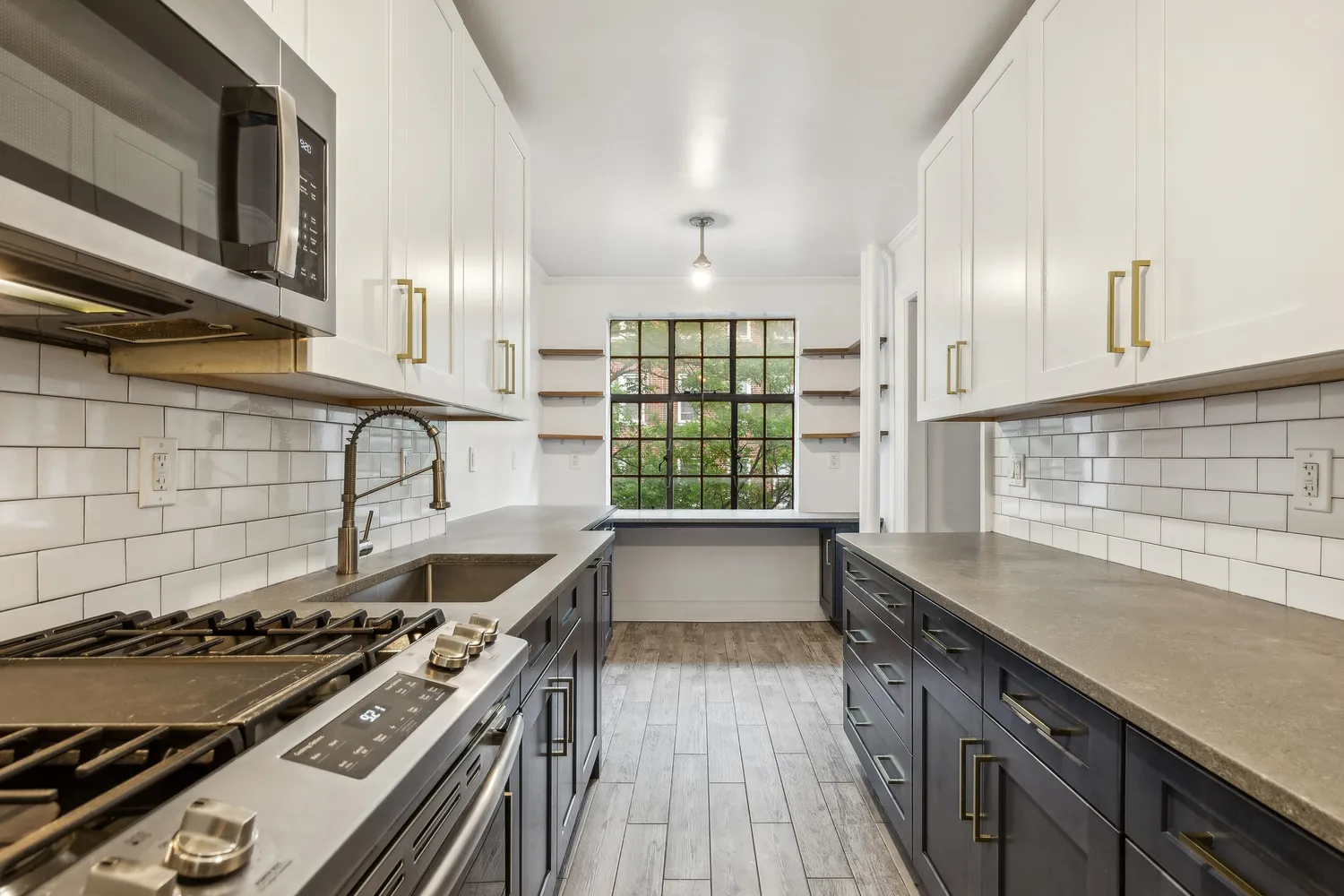 a kitchen with a stove and a wooden cabinets