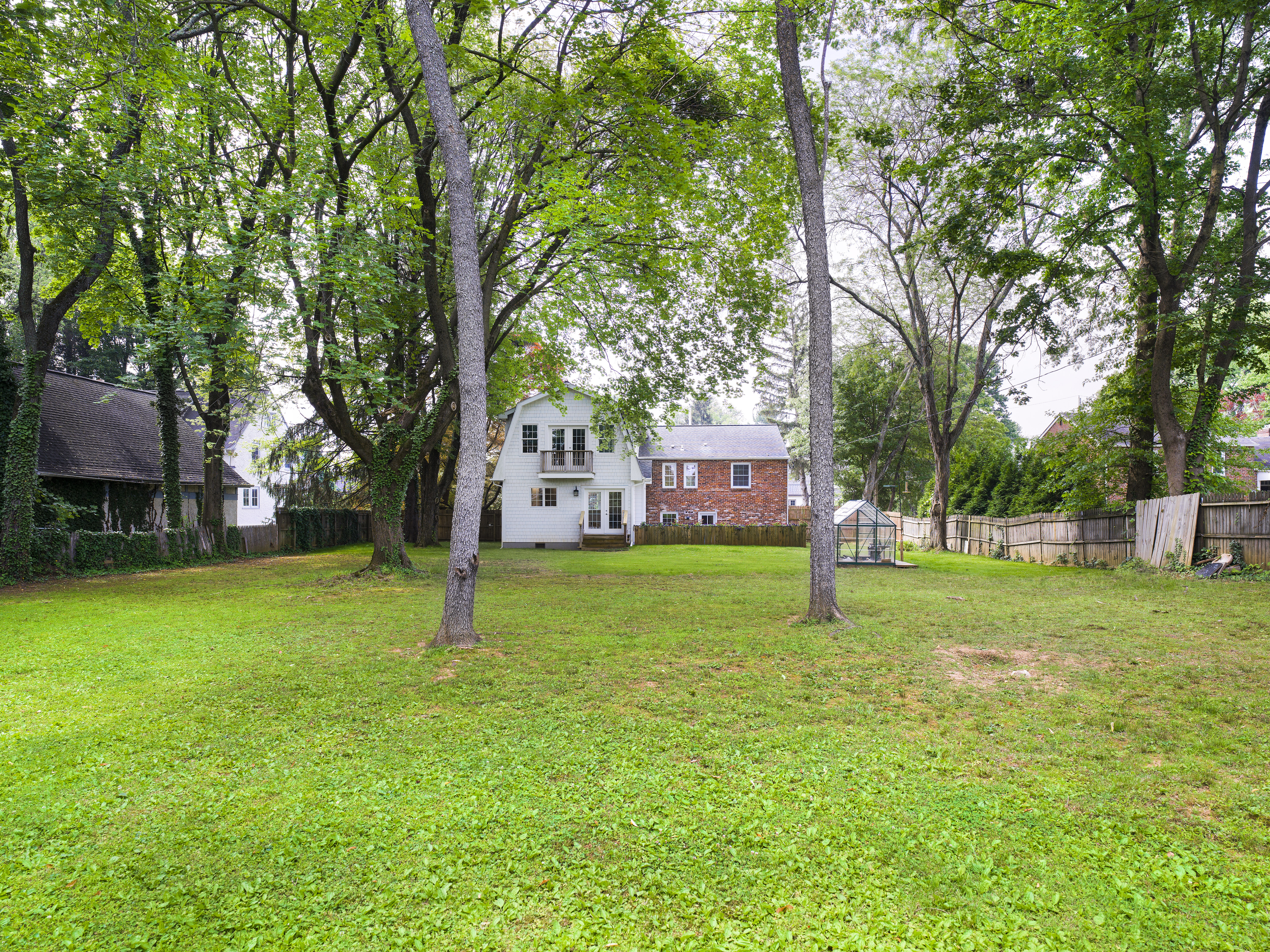 319 West Conestoga Road Devon, PA 19333 - Photo 5 of 38 a house is sitting in middle od the grass