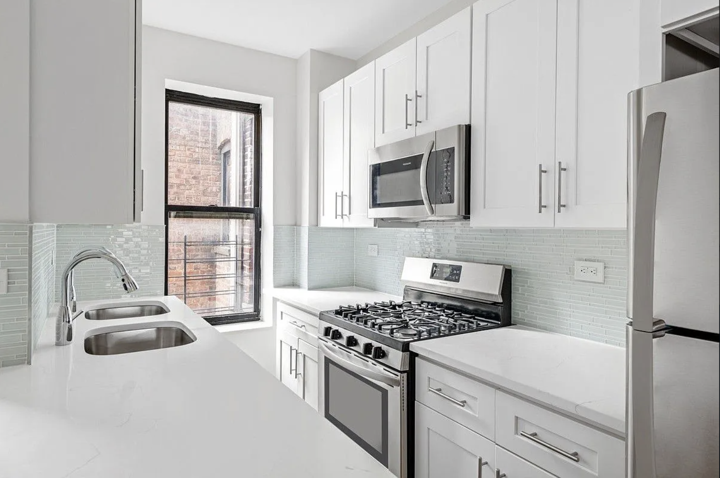 601 Crown Street, Unit C3 Brooklyn, NY 11213 - Photo 3 of 9 a kitchen with granite countertop a sink stove and refrigerator