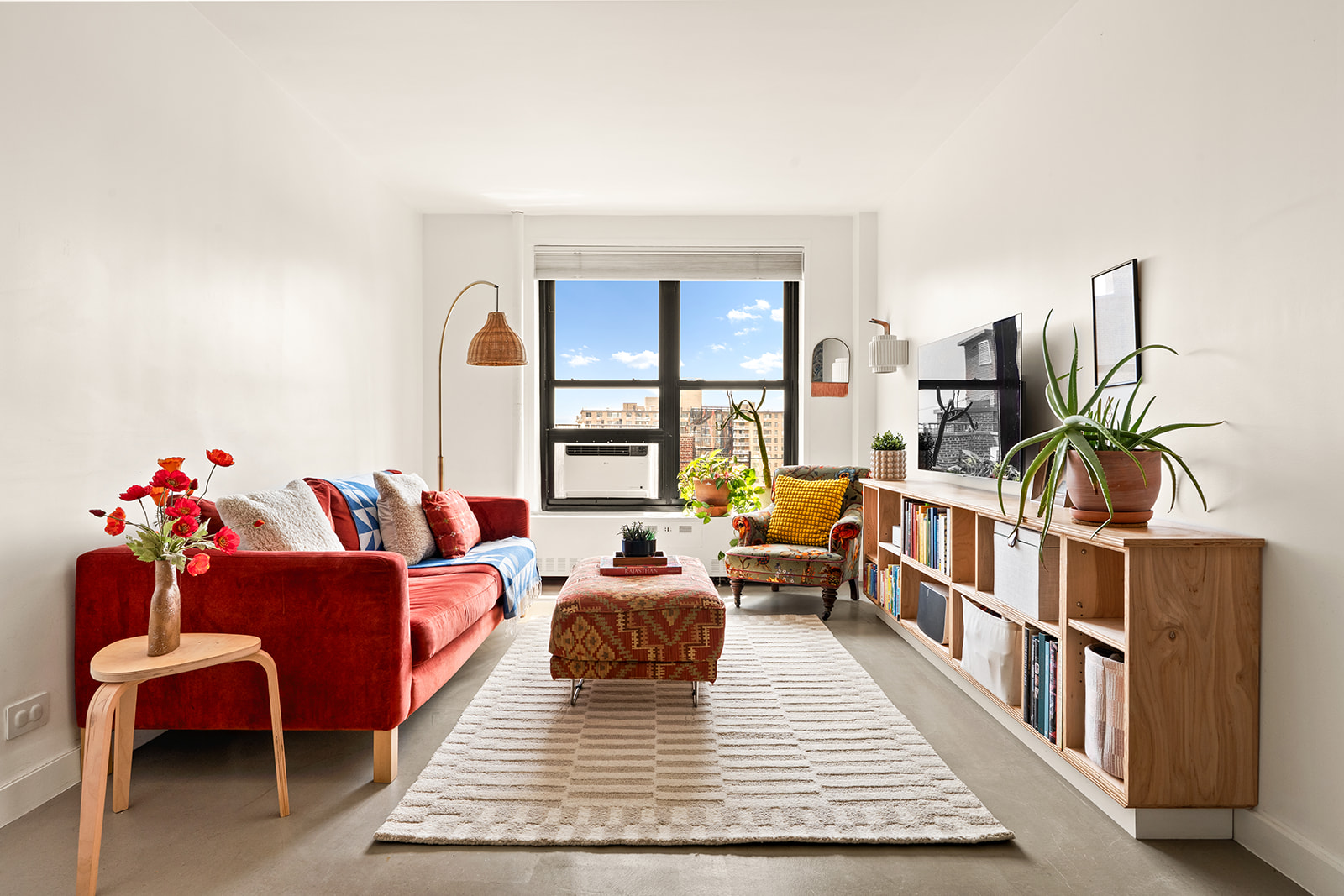 185 Clinton Avenue, Unit 14F Brooklyn, NY 11205 - Photo 1 of 9 a living room with furniture rug and wooden floor