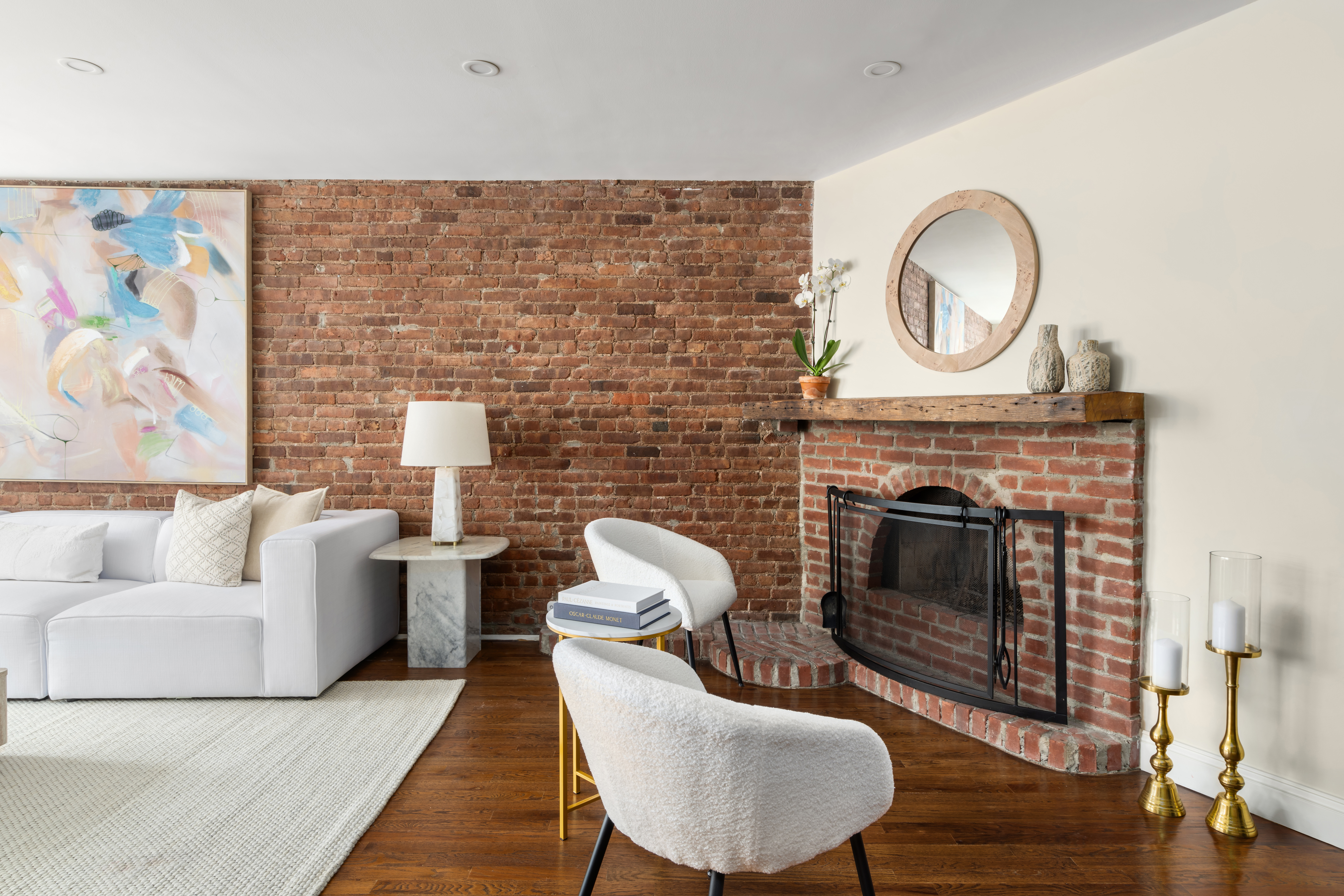 99 Reade Street, Unit 5E Manhattan, NY 10013 - Photo 3 of 13 a living room with furniture and a fireplace