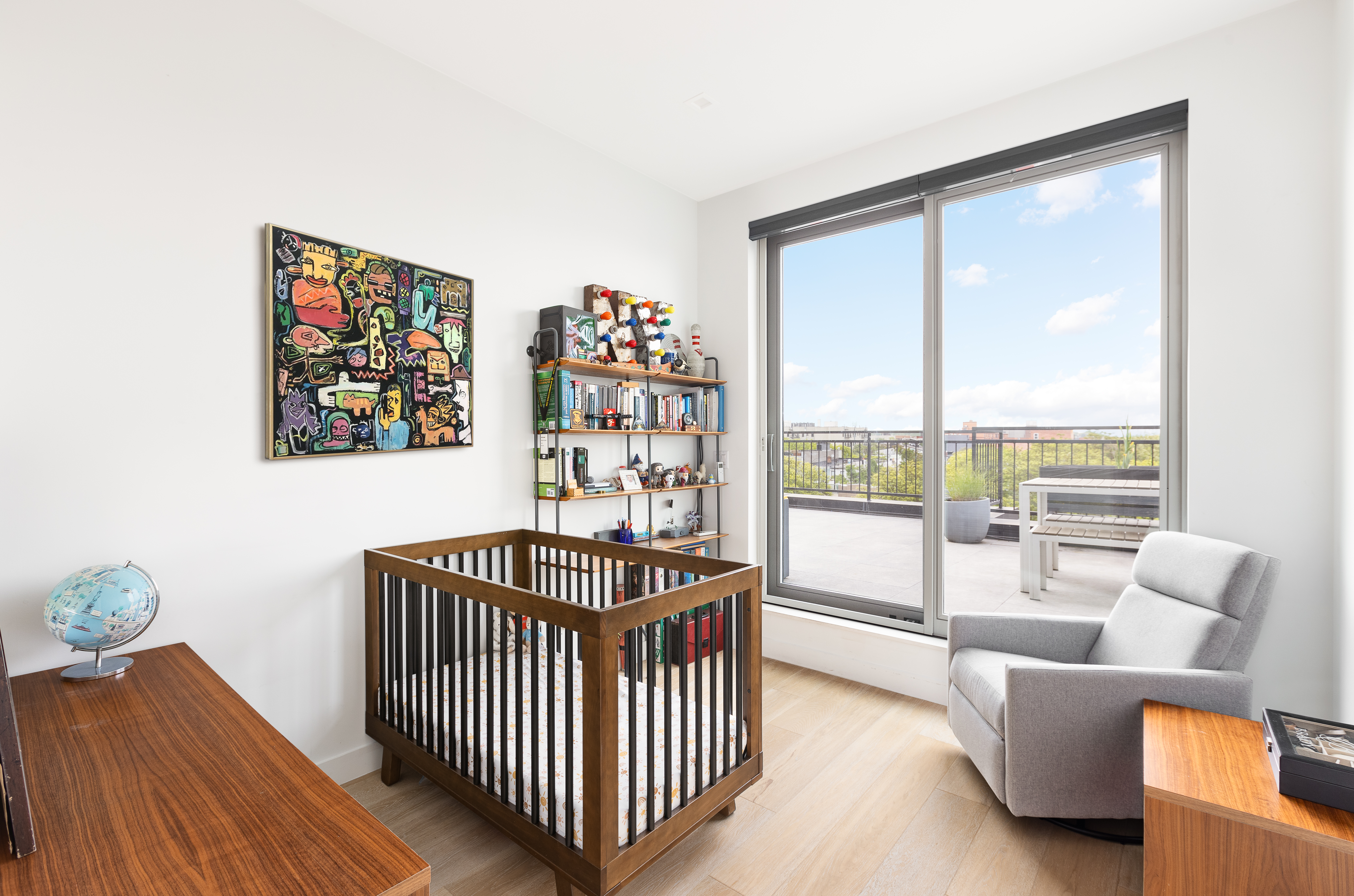 1122 Lafayette Avenue, Unit 4C Brooklyn, NY 11221 - Photo 5 of 14 a bedroom with furniture and a large window