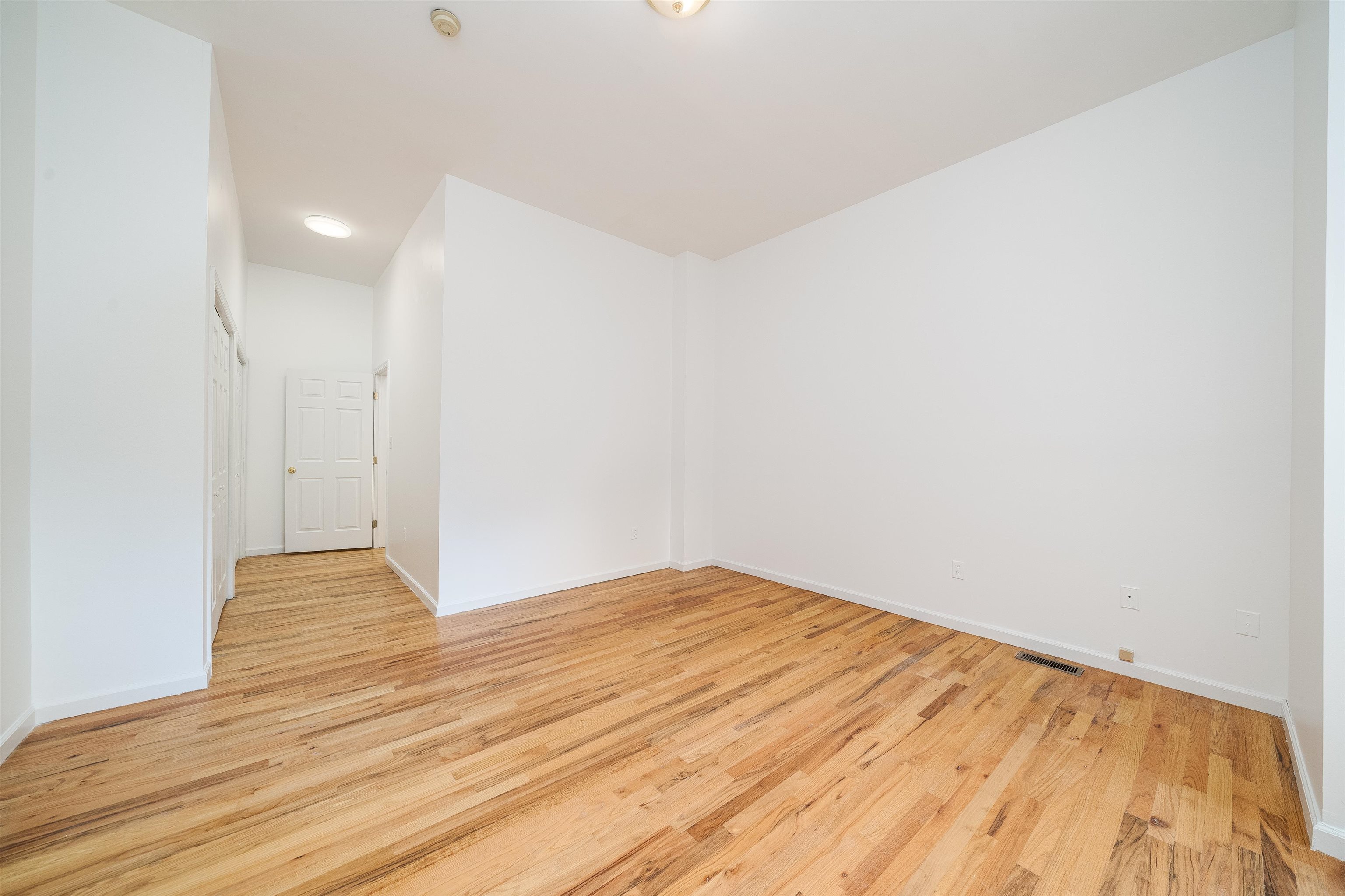 639 Garden Street, Unit 1 Hoboken, NJ 07030 - Photo 14 of 17 a view of empty room with wooden floor