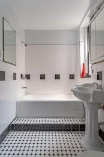 a bathroom with a bathtub and a sink