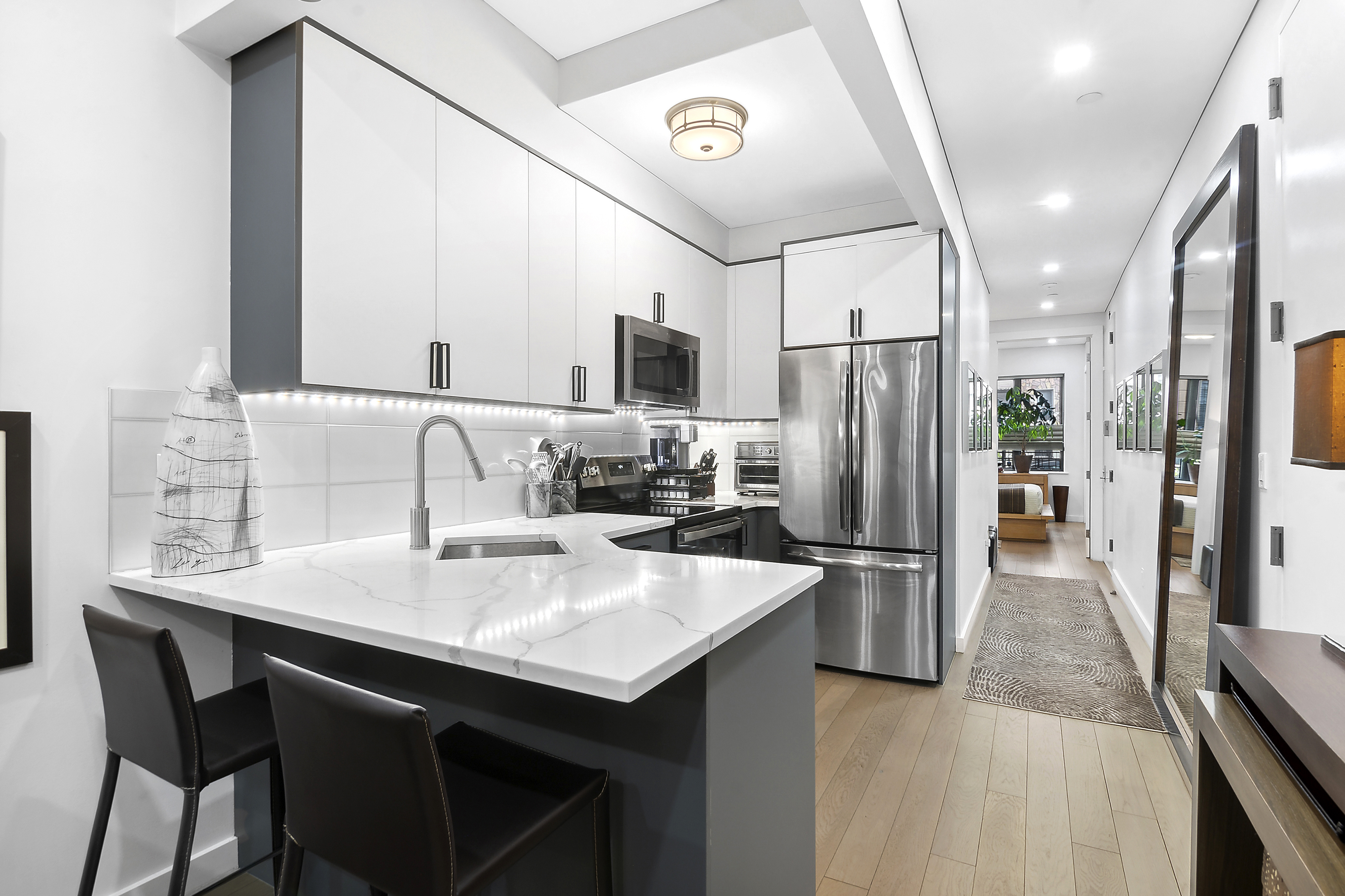 1043 Halsey Street, Unit 1 Brooklyn, NY 11207 - Photo 6 of 14 a kitchen with refrigerator and sink