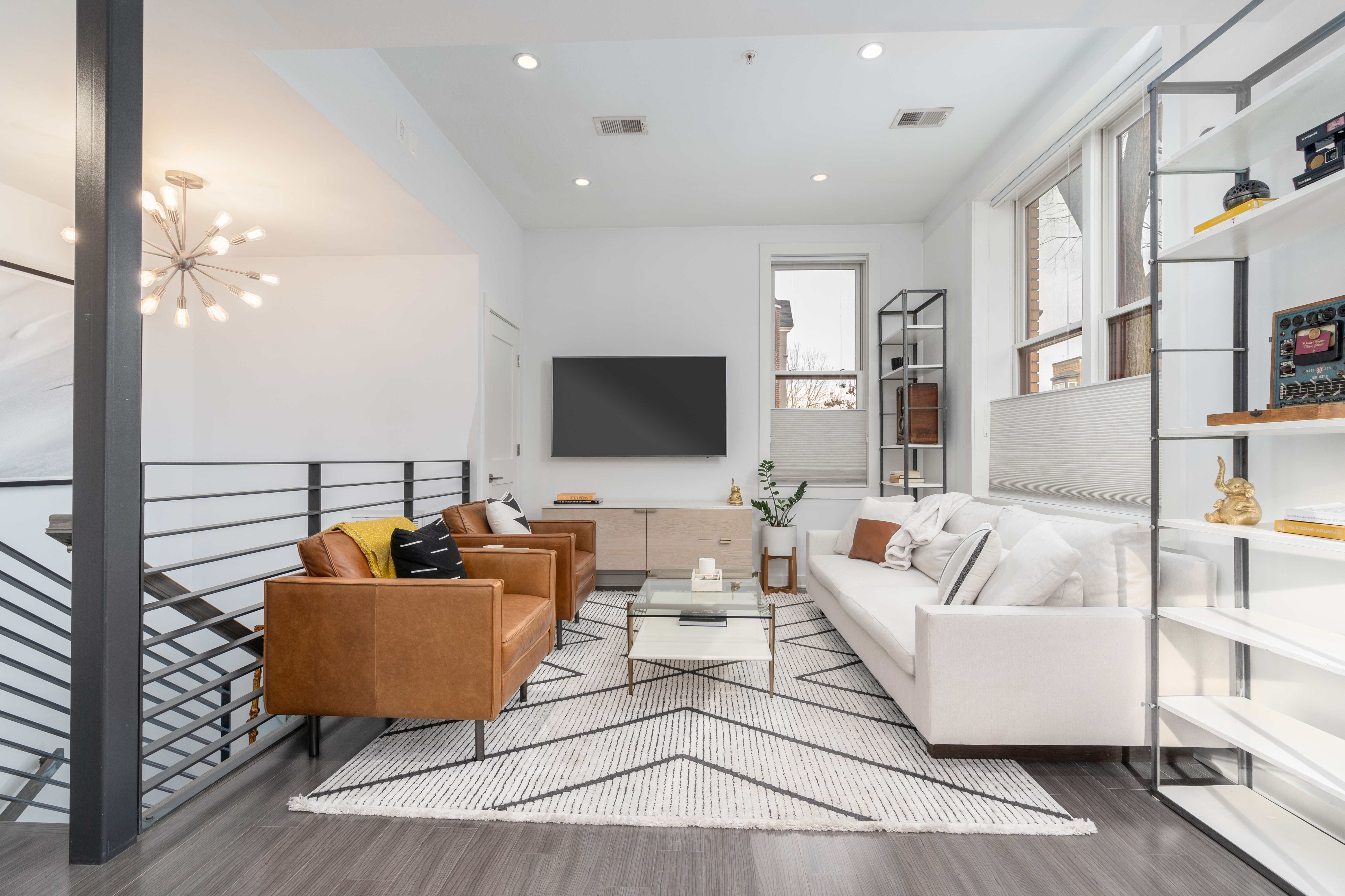 1740 New Jersey Avenue Northwest, Unit 2 Washington, DC 20001 - Photo 2 of 35 a living room with furniture and a flat screen tv