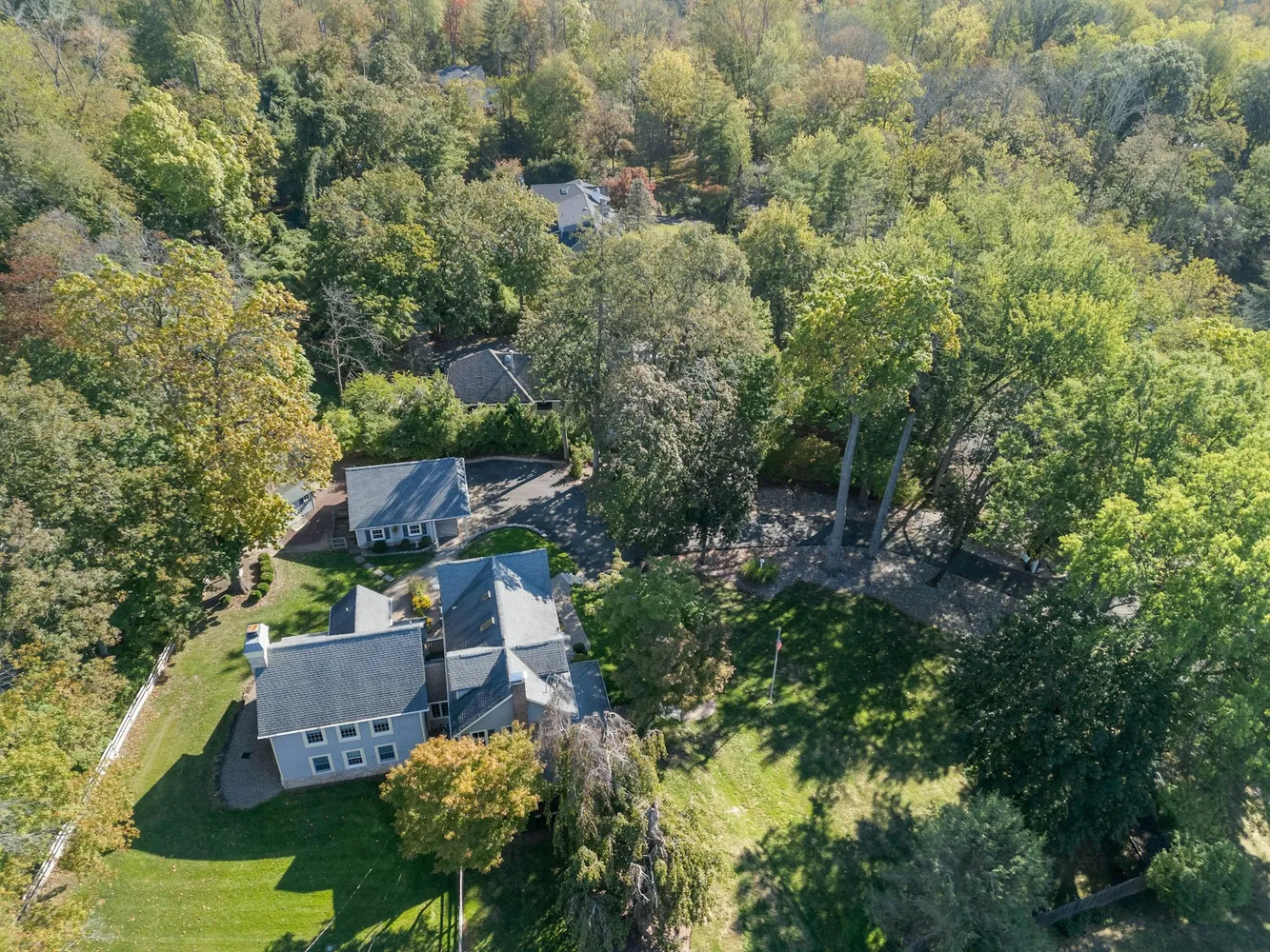 a view of a house with backyard sitting area and garden