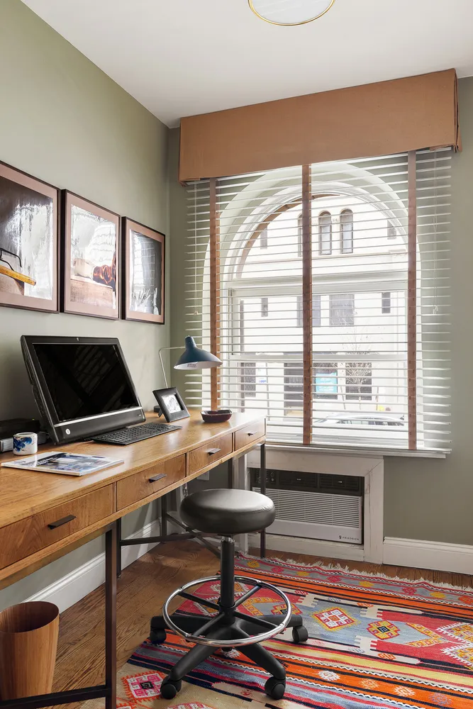 a workspace with furniture and a window