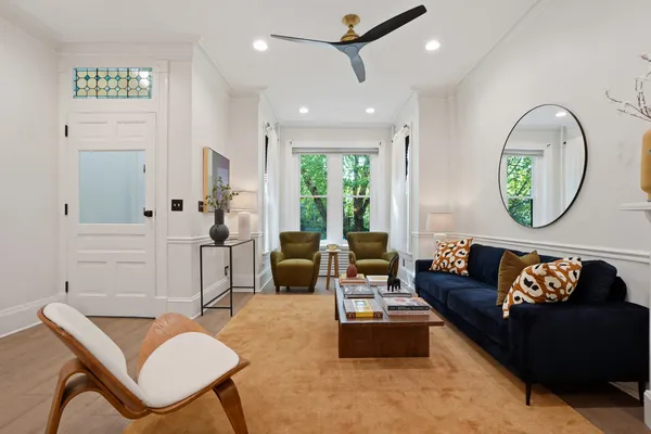 a living room with furniture and a large window