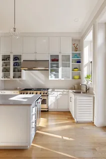 a kitchen with stainless steel appliances granite countertop a stove and a sink