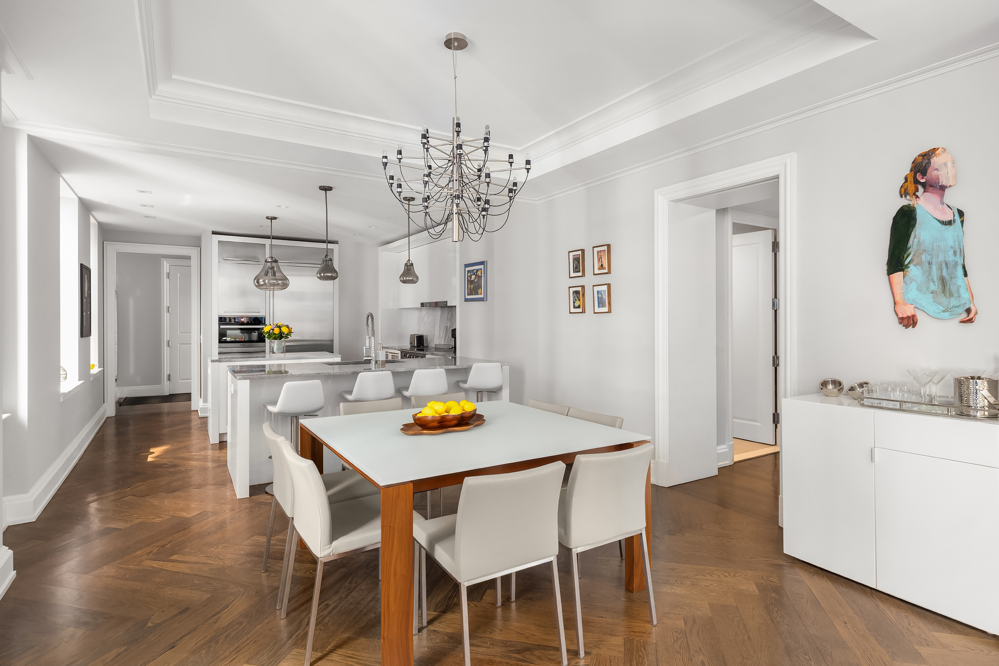 344 West 72nd Street, Unit 1007 Manhattan, NY 10023 - Photo 7 of 23 a view of a dining room with furniture and chandelier