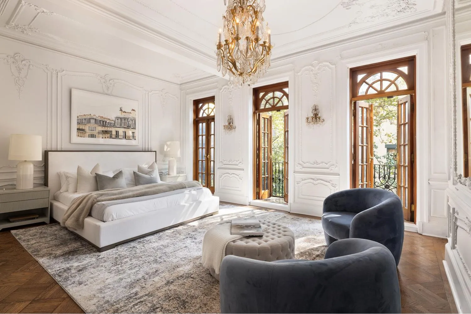 a spacious bedroom with a bed and a couch