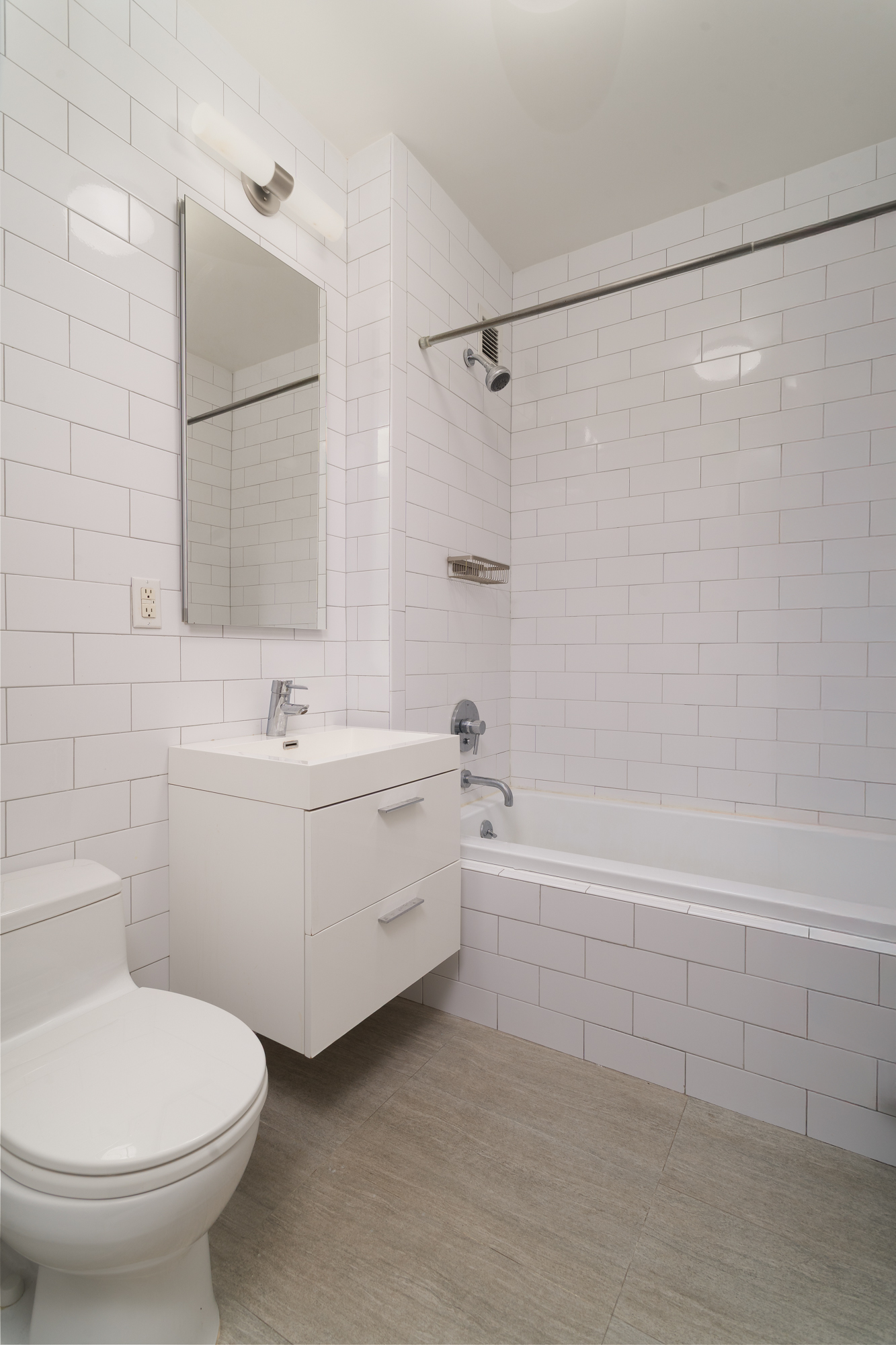 753 St Nicholas Avenue, Unit 2B Manhattan, NY 10031 - Photo 7 of 10 a bathroom with a sink toilet and shower