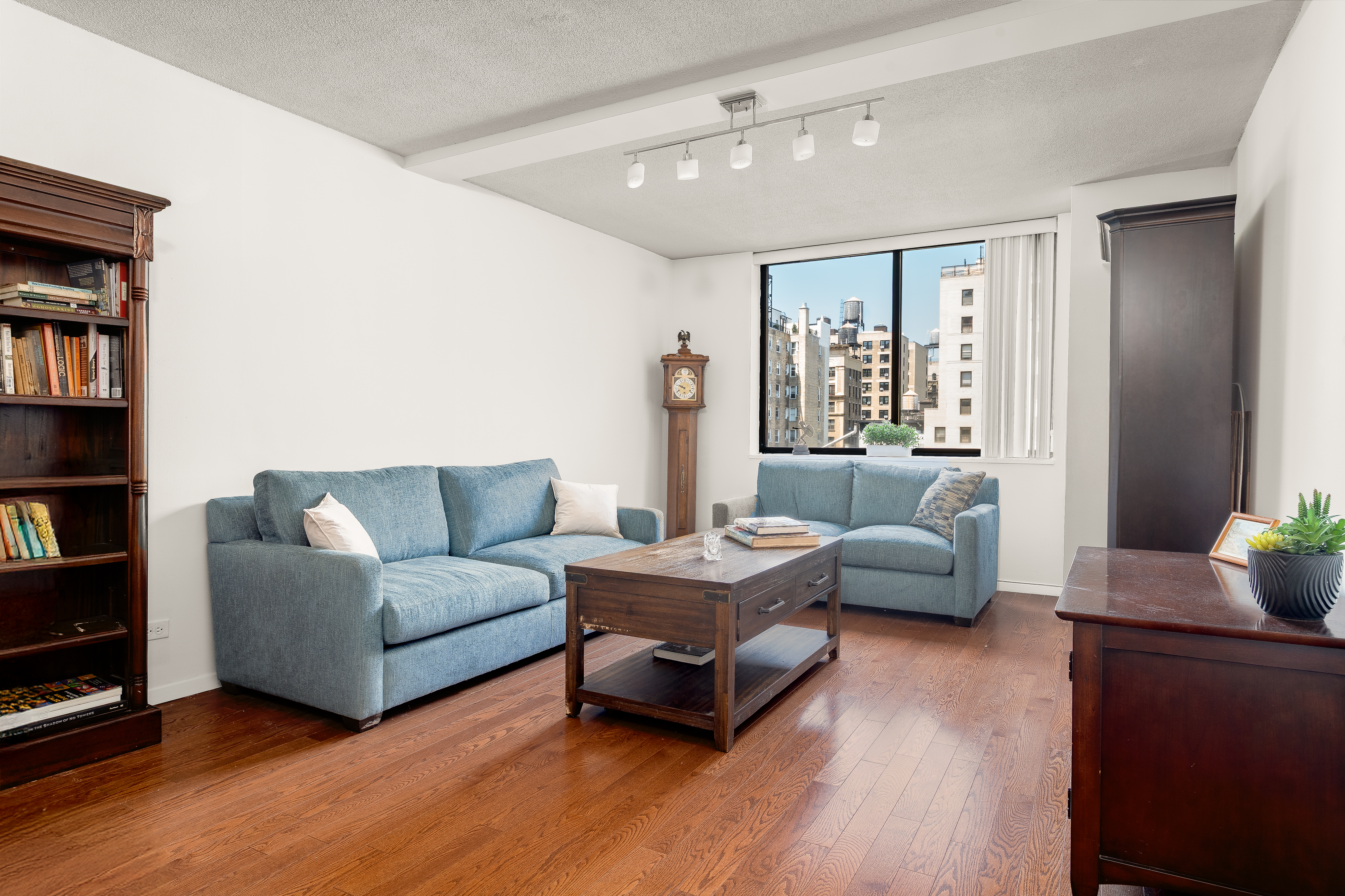 275 West 96th Street, Unit 12B Manhattan, NY 10025 - Photo 3 of 28 a living room with furniture and a wooden floor