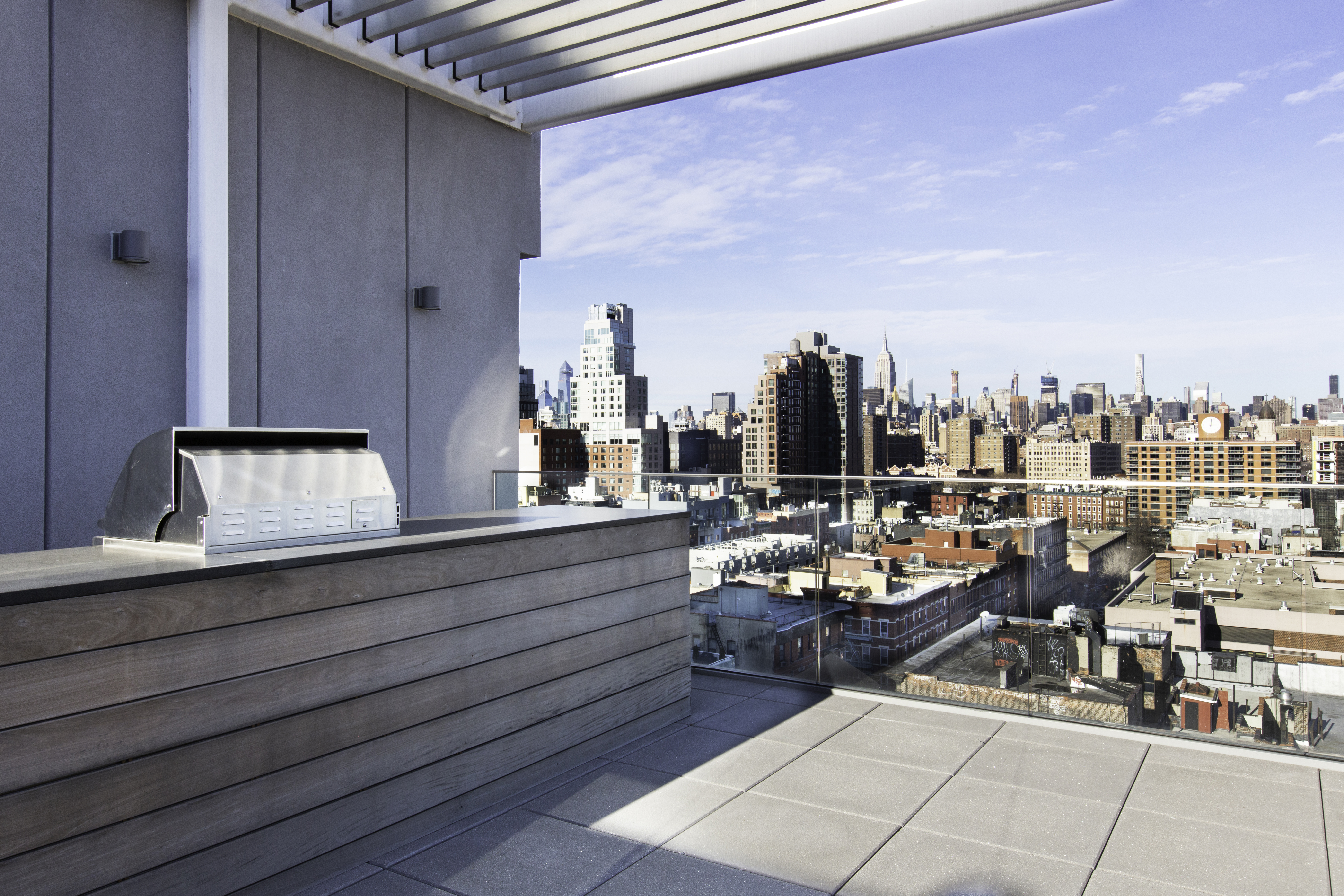 100 Norfolk Street, Unit PH Manhattan, NY 10002 - Photo 22 of 23 a view of a terrace with chairs and a potted plant