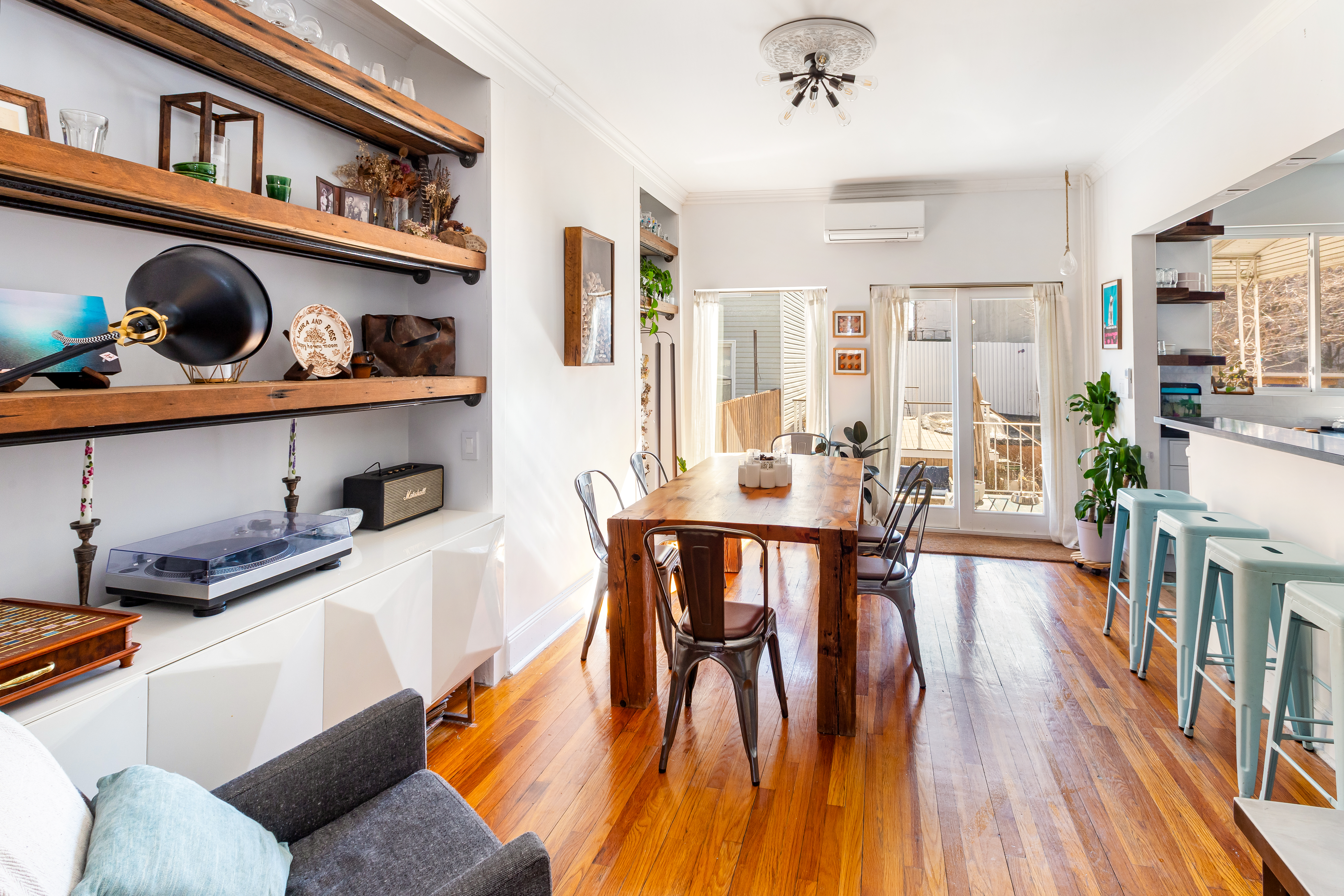 214 Eagle Street Brooklyn, NY 11222 - Photo 4 of 22 a dining room with wooden floor and furniture