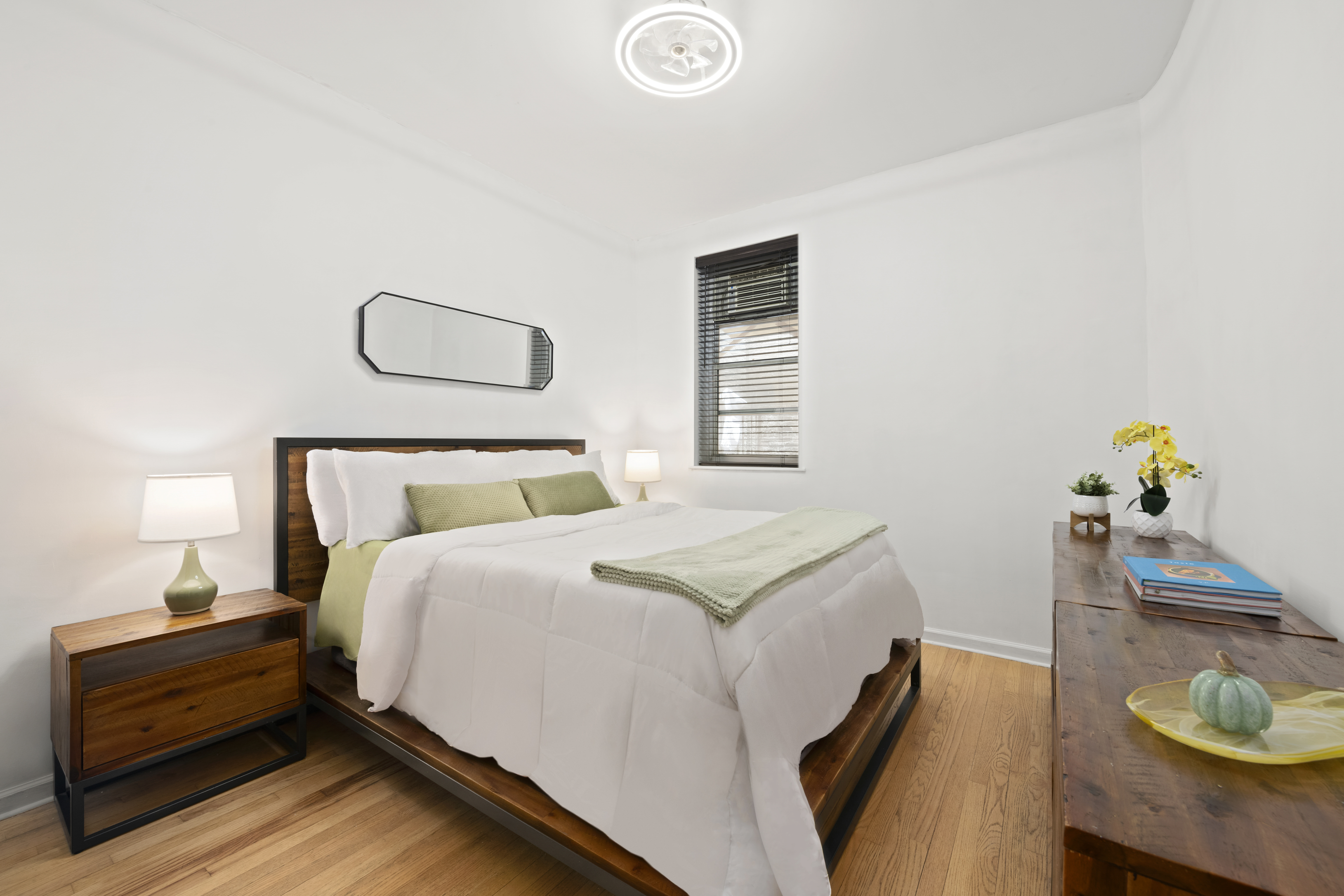 406 West 46th Street, Unit 1B Manhattan, NY 10036 - Photo 4 of 8 a bed room with a bed and a window