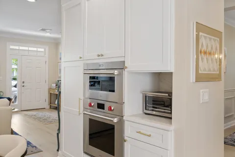a kitchen with cabinets and appliances