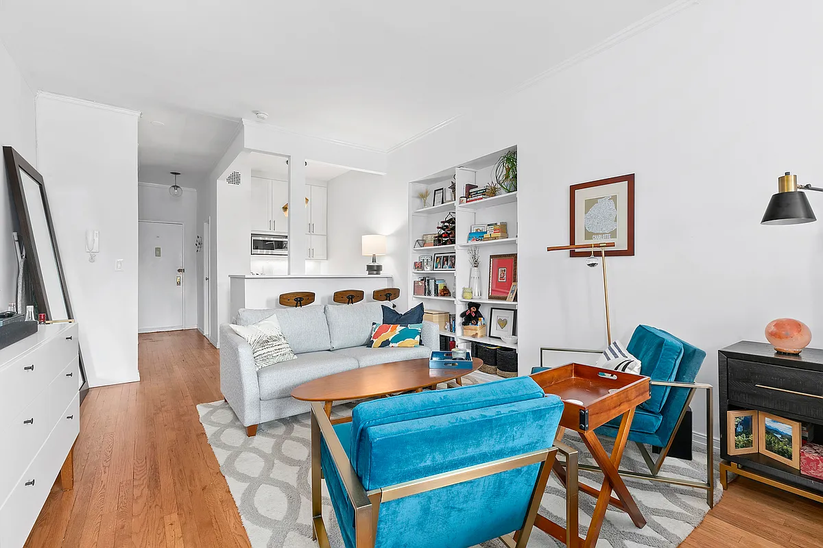 99 Bank Street, Unit 50 Manhattan, NY 10014 - Photo 5 of 7 a living room with furniture a flat screen tv and a rug