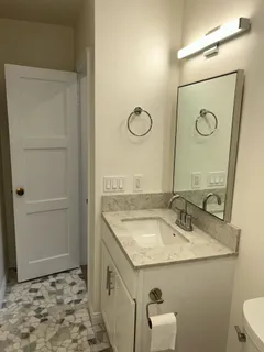 a bathroom with a sink and a mirror