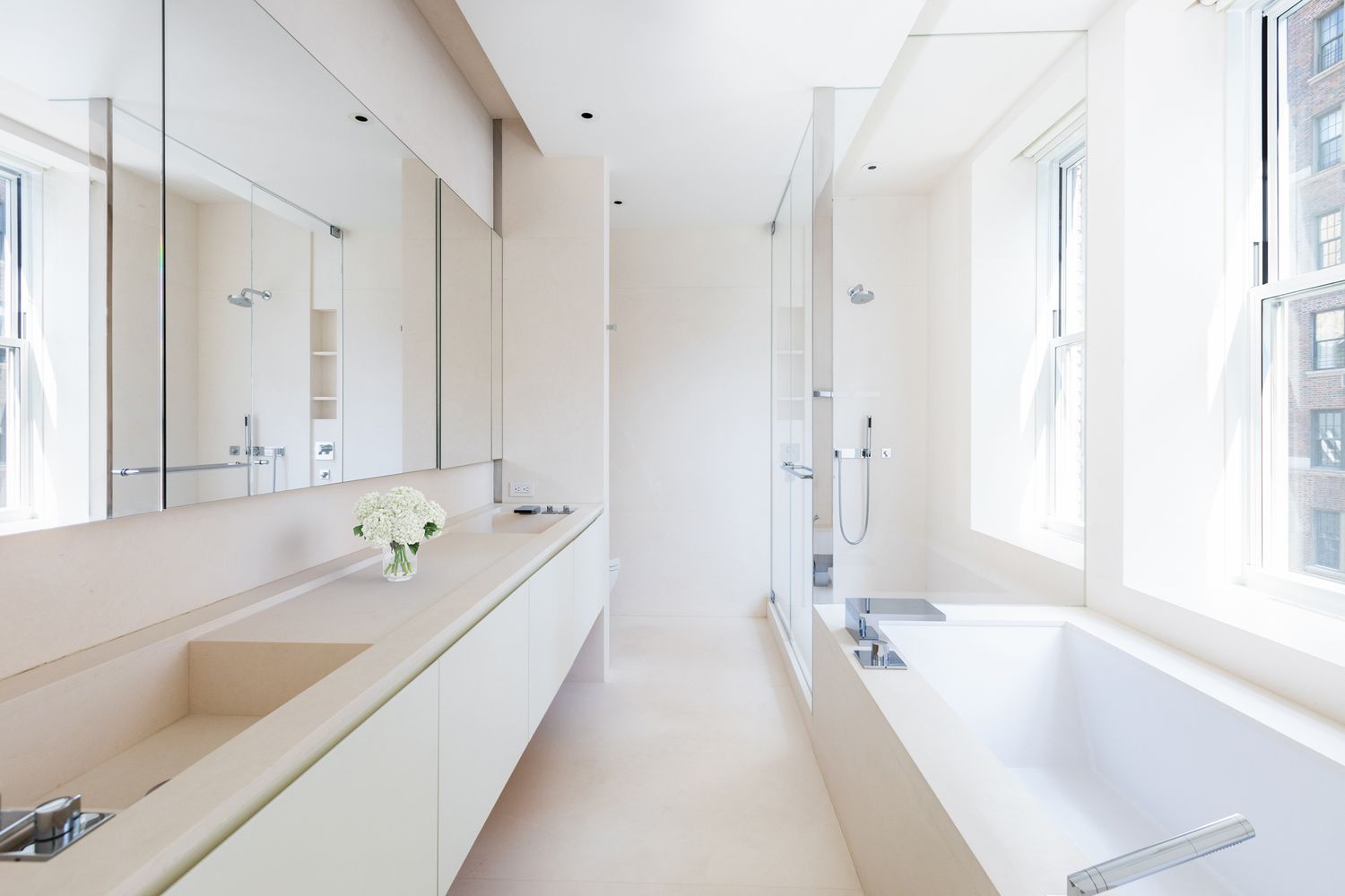 876 Park Avenue, Unit 7N Manhattan, NY 10075 - Photo 12 of 21 a spacious bathroom with a tub sink and mirror