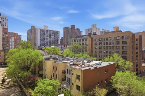 a view of a city with tall buildings