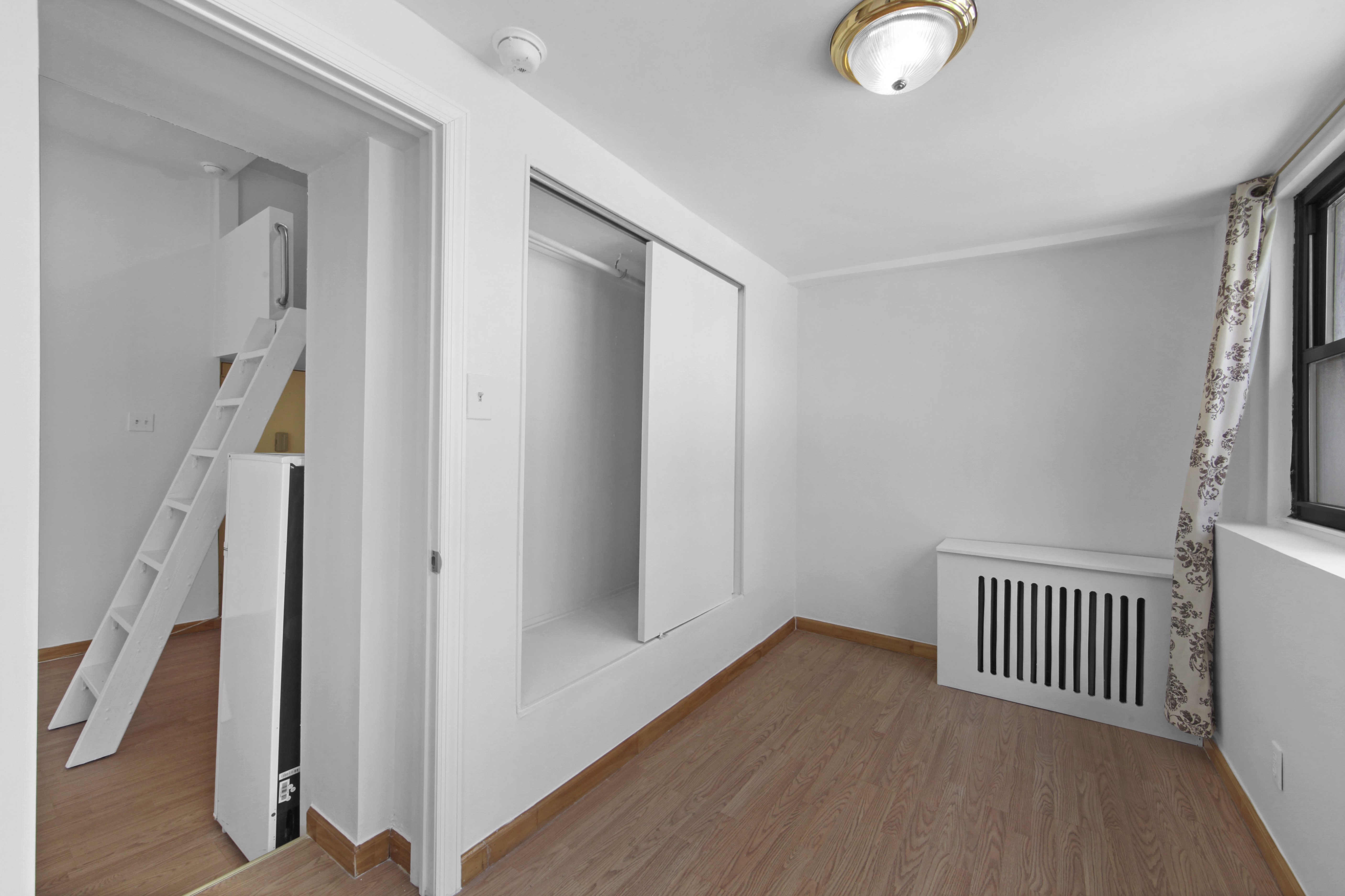 155 Hicks Street, Unit 2B Brooklyn, NY 11201 - Photo 5 of 11 a view of a livingroom with wooden floor and entryway