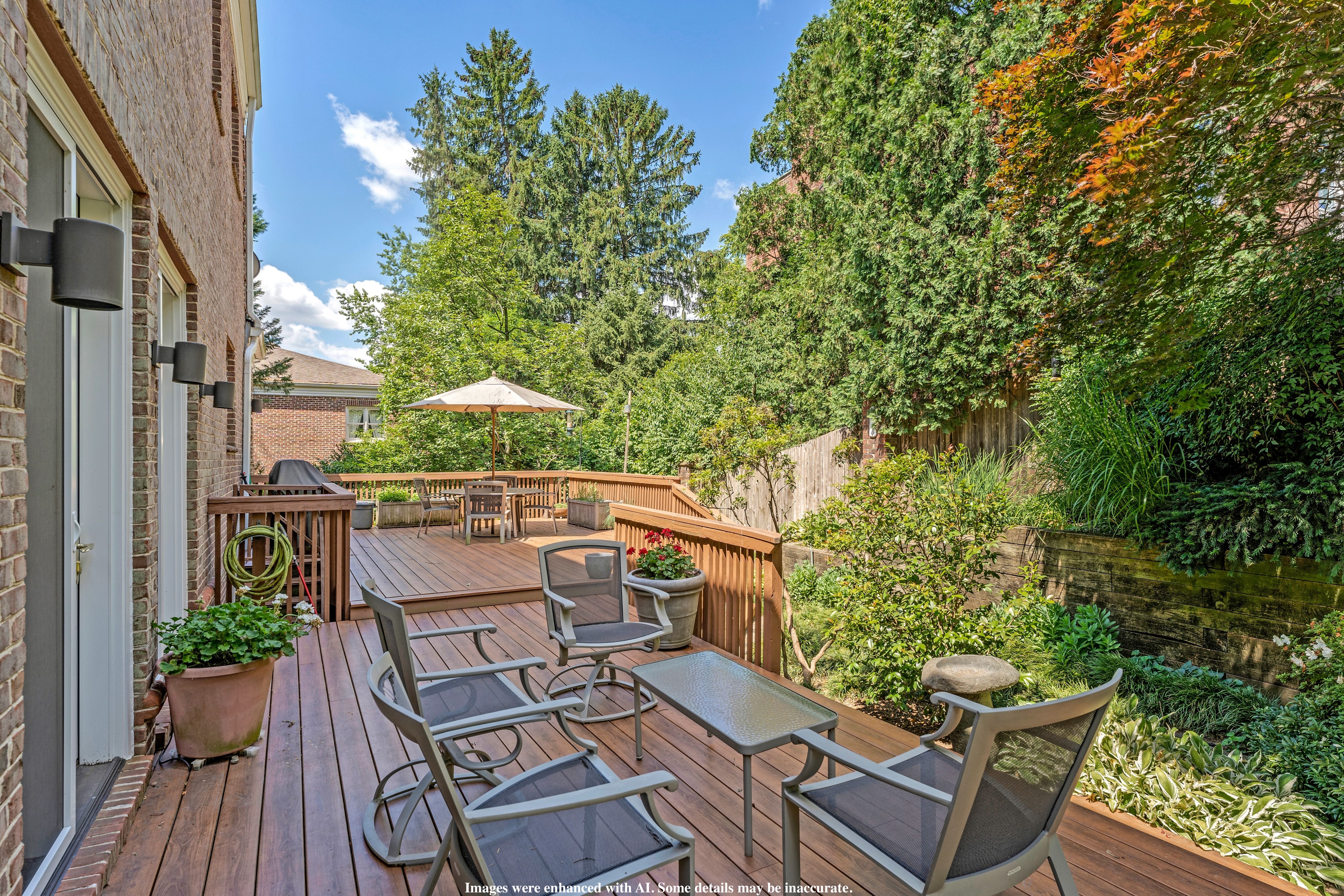 4753 Reservoir Road Northwest Washington, DC 20007 - Photo 42 of 51 a view of a patio with table and chairs and potted plants with wooden floor and fence