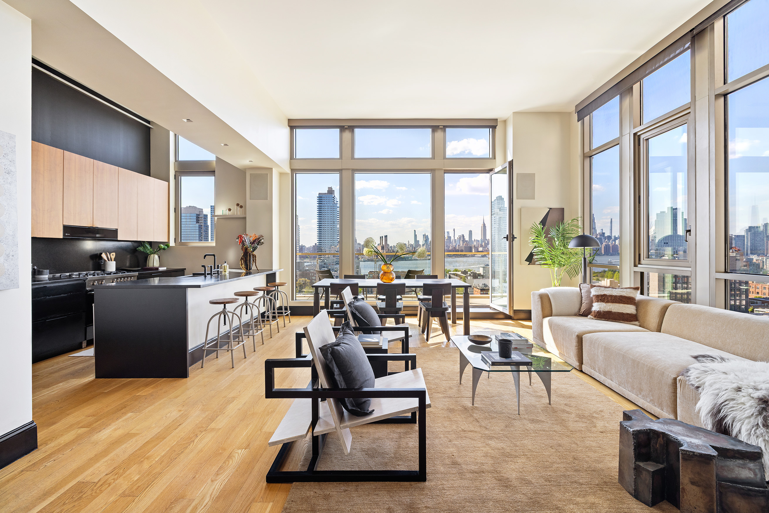 144 North 8th Street, Unit 12A Brooklyn, NY 11249 - Photo 1 of 21 a living room with furniture large windows and wooden floor