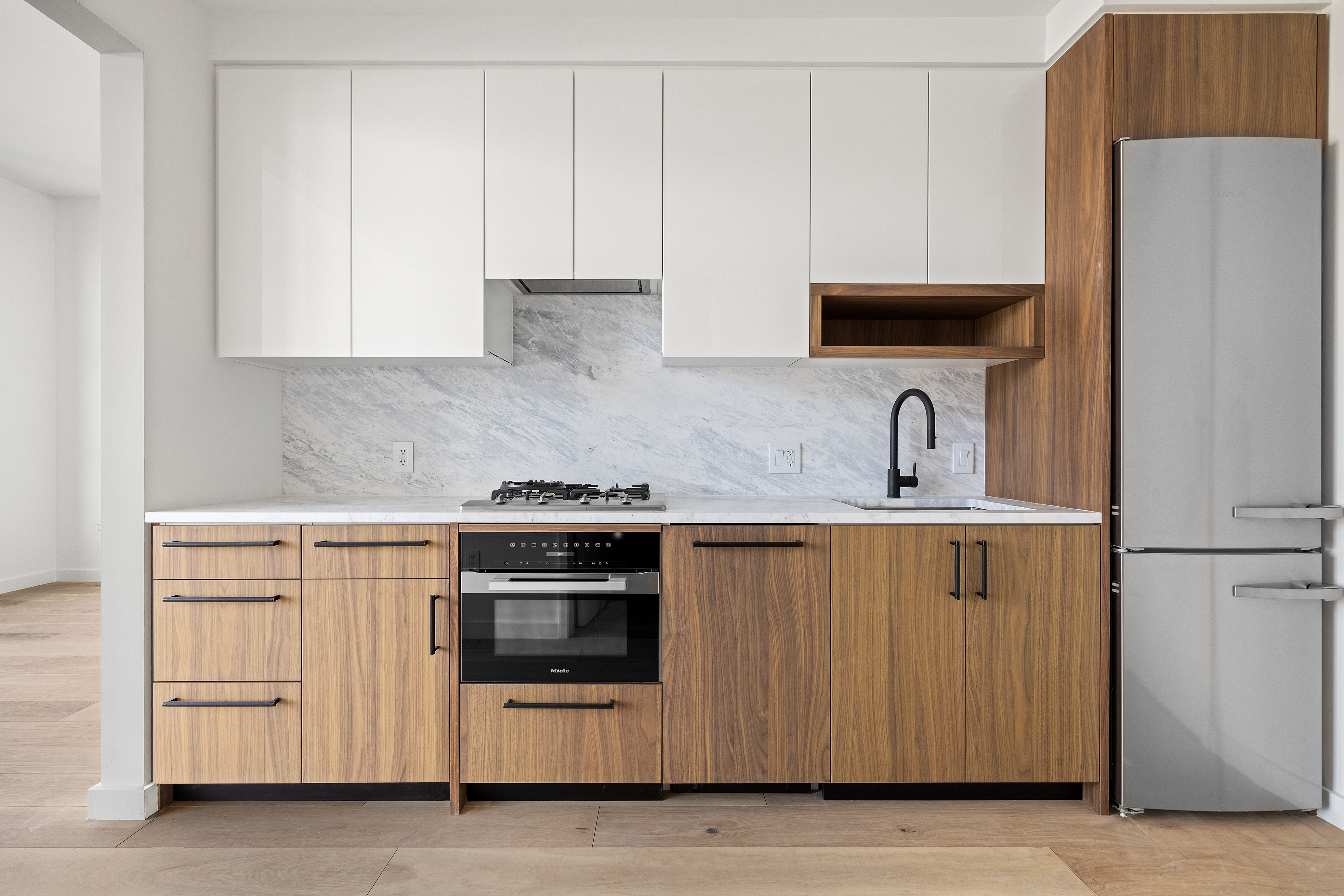 29 Huron Street, Unit 6AE Brooklyn, NY 11222 - Photo 3 of 13 a kitchen with white cabinets and white appliances